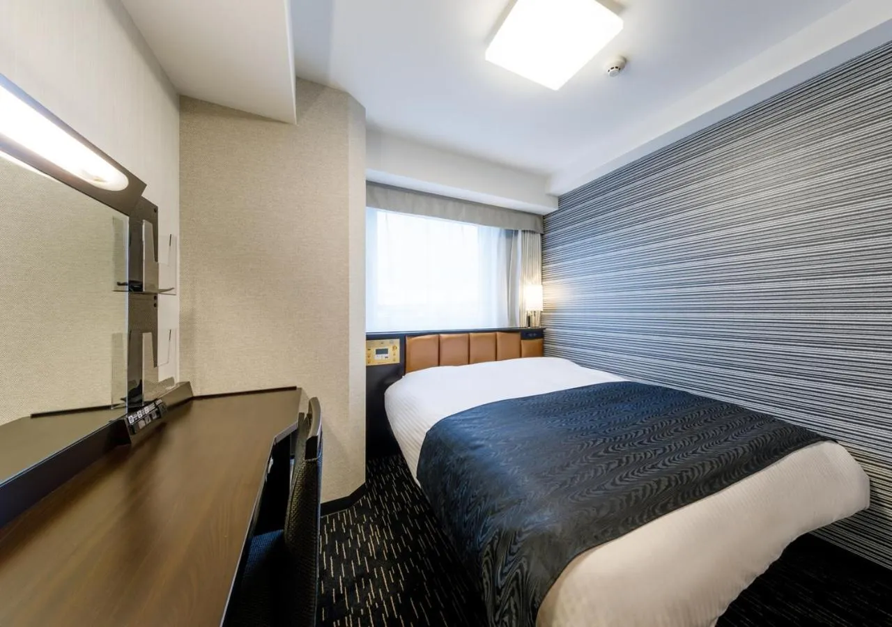Photo of the whole room, Bed in APA Hotel Hakata Gion Ekimae