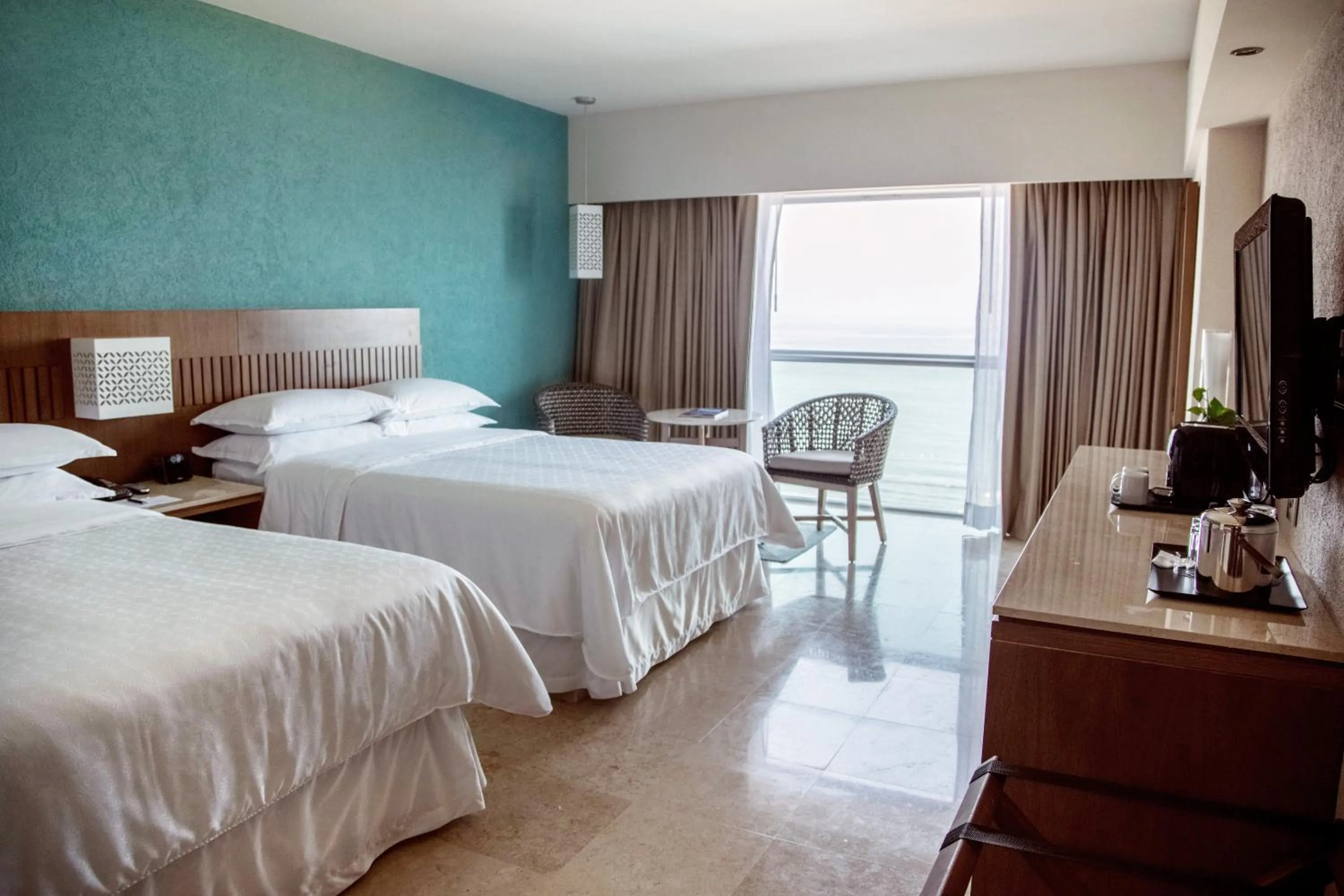 Bed in Sheraton Buganvilias Resort & Convention Center