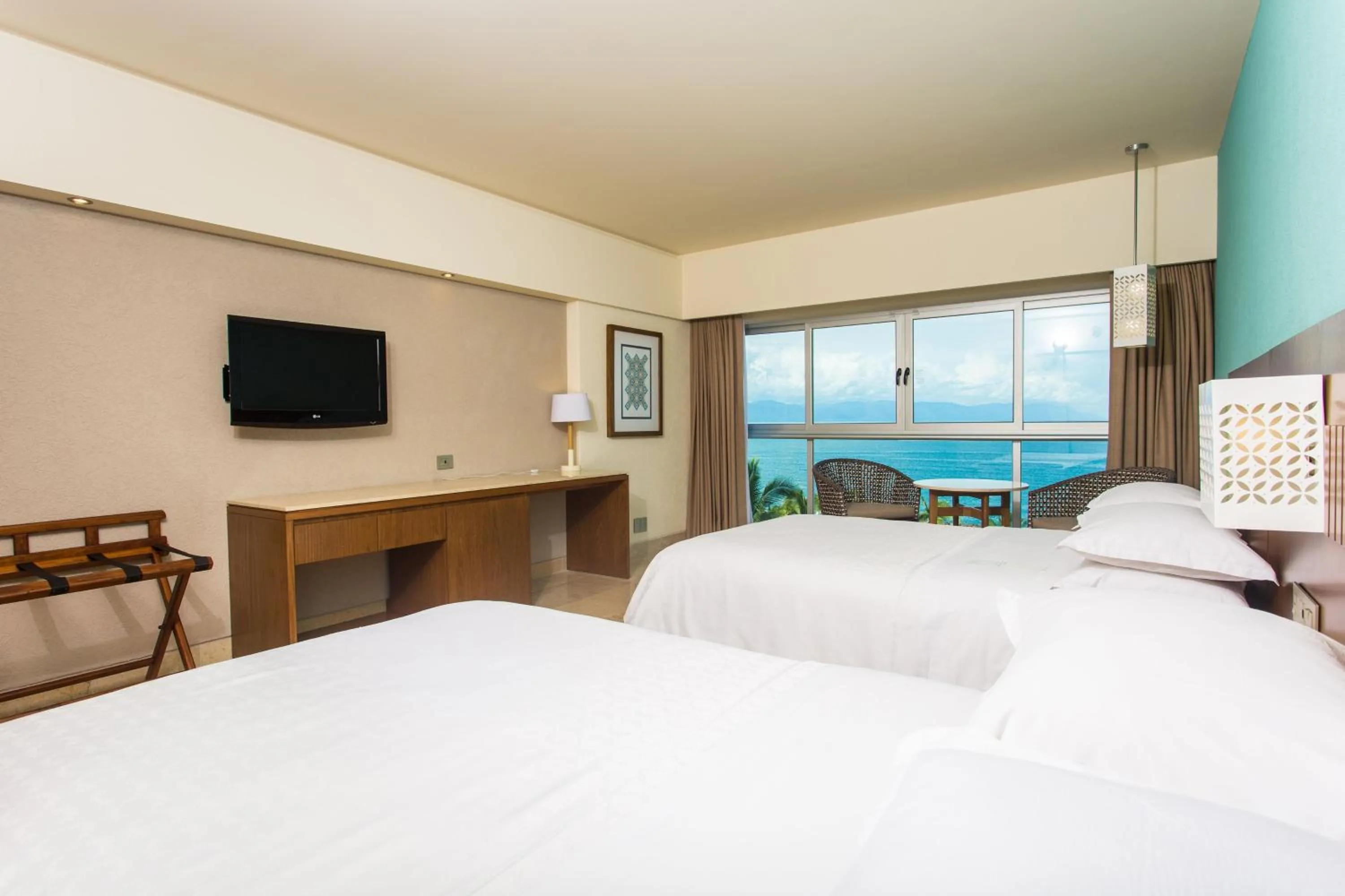 Photo of the whole room, Bed in Sheraton Buganvilias Resort & Convention Center