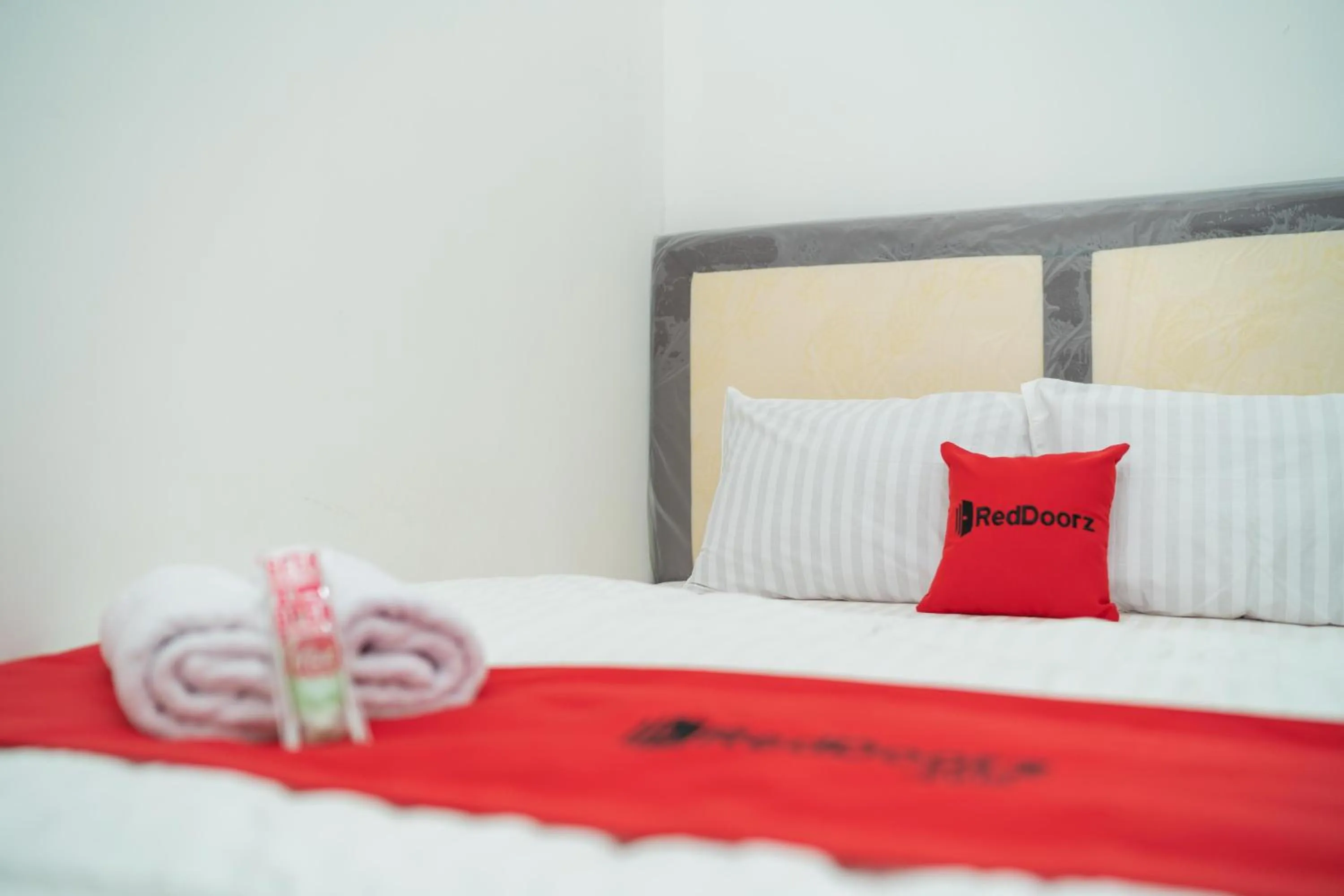 Bed in RedDoorz near Bundaran Ciceri