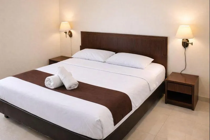 Bed in Manggar Indonesia Hotel