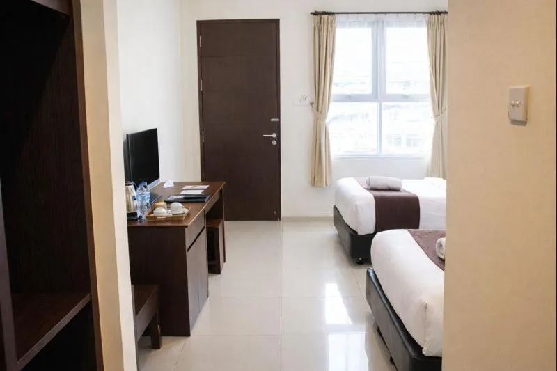 Bed in Manggar Indonesia Hotel