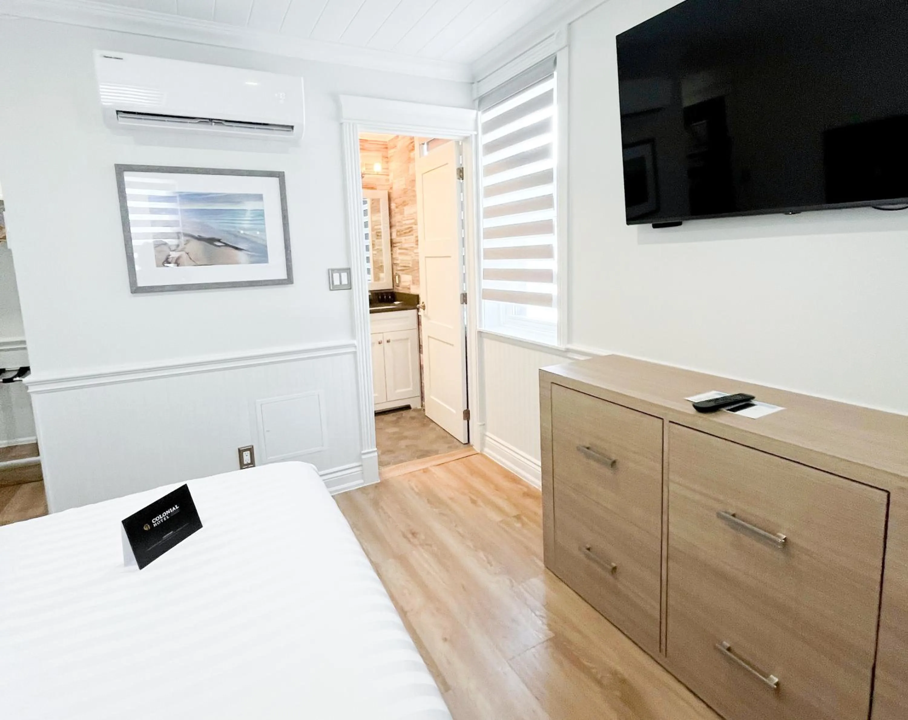 Bed in Colonial Hotel & Suites