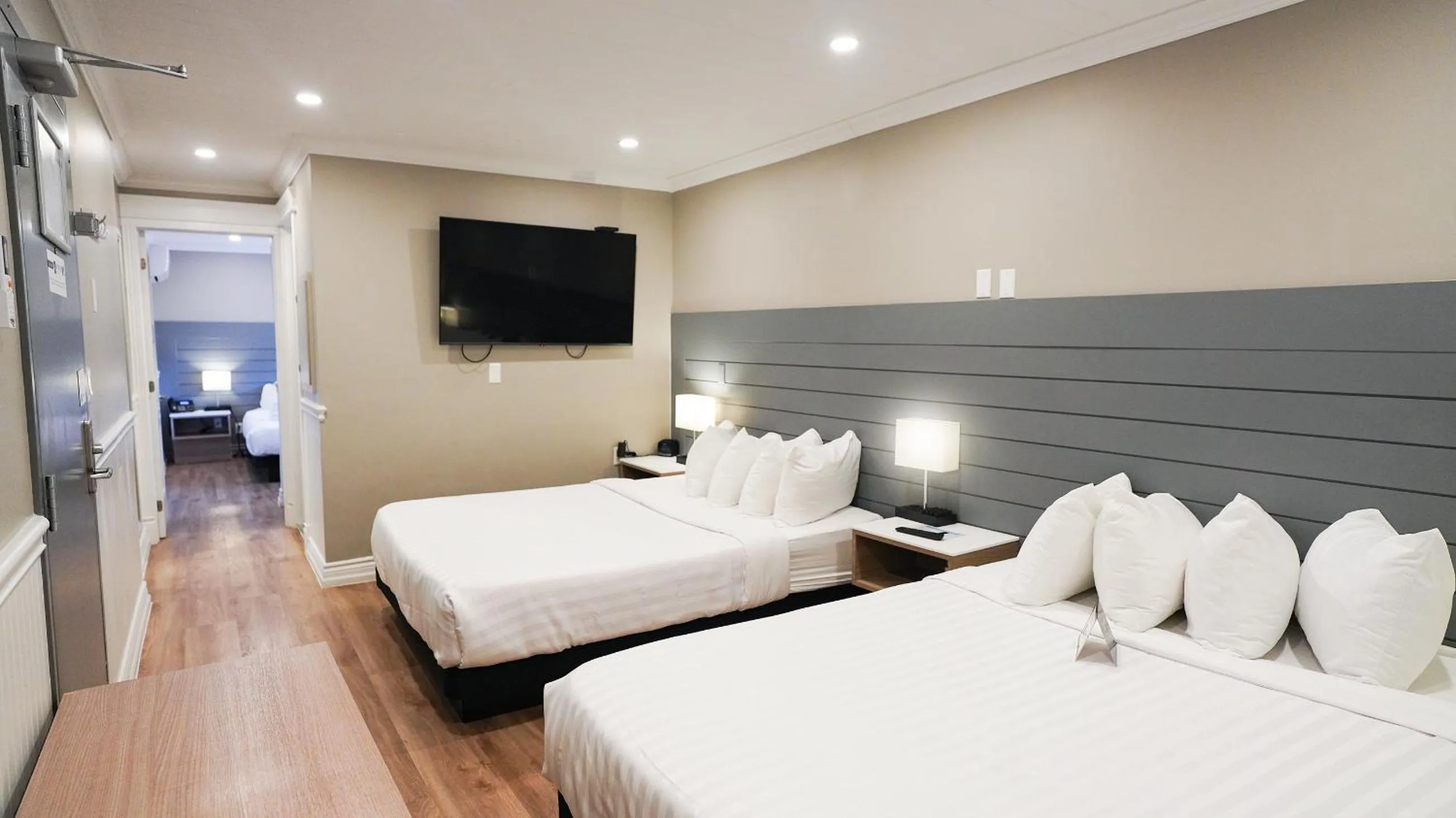 Bed in Colonial Hotel & Suites