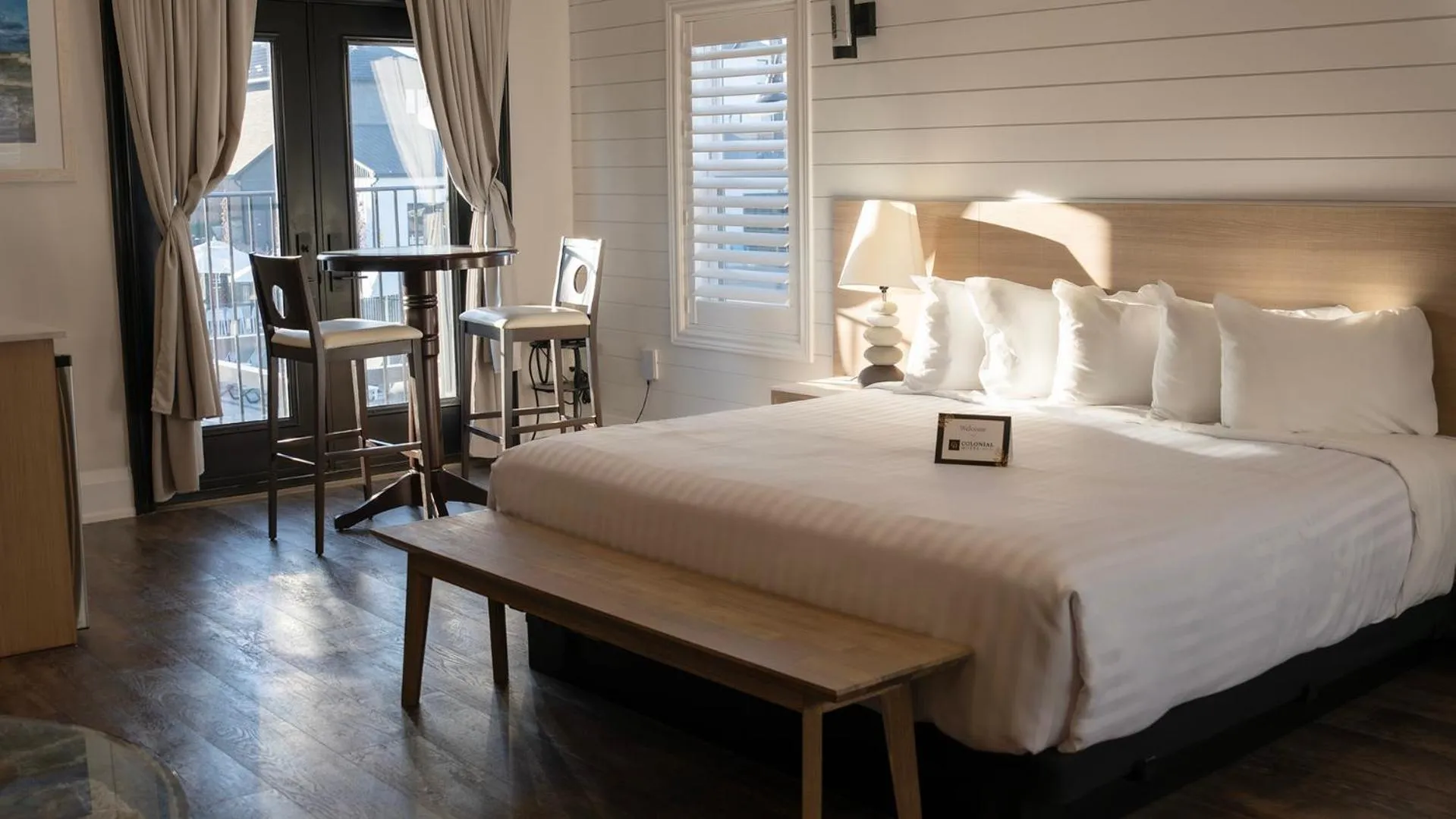 Bed in Colonial Hotel & Suites