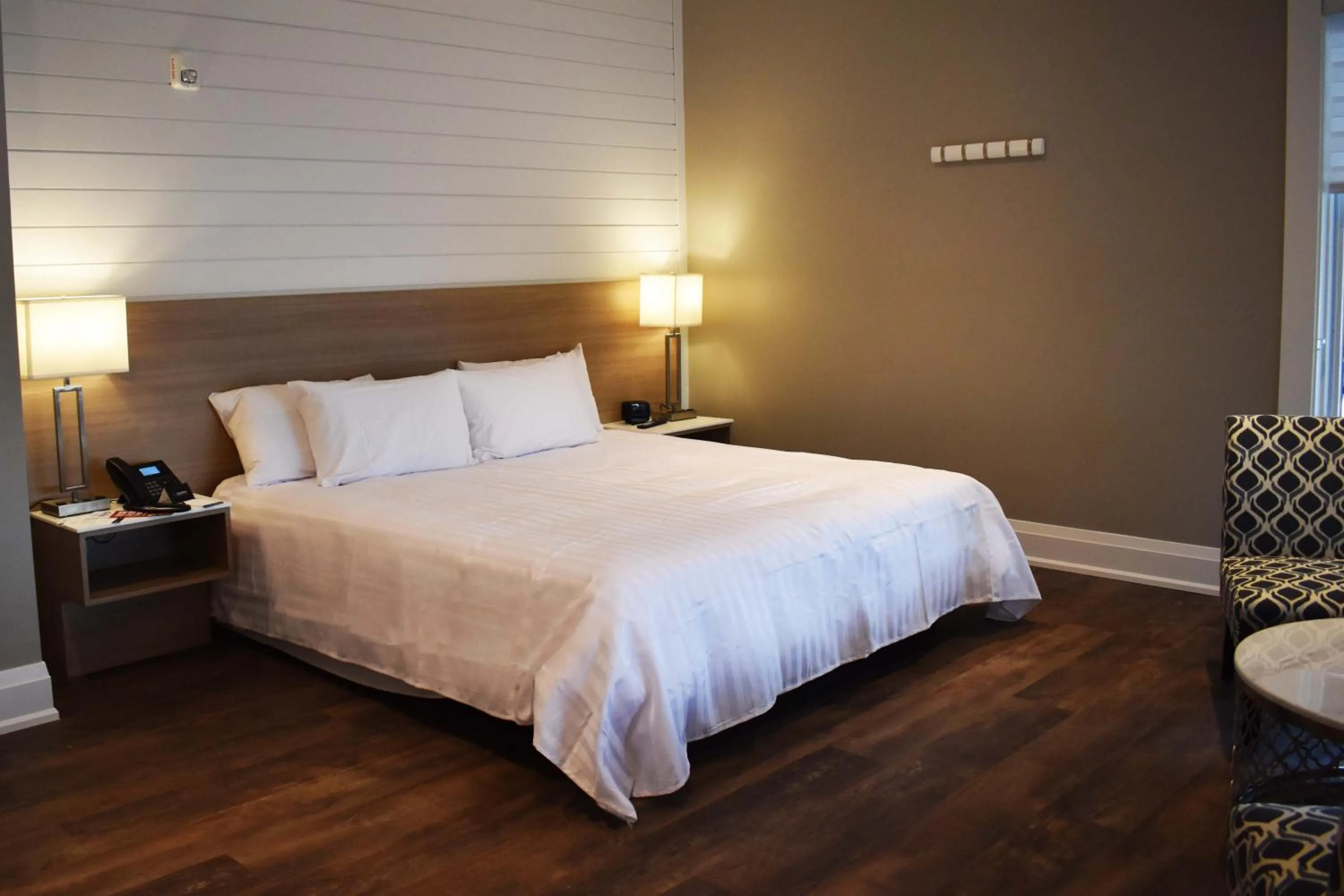 Bed in Colonial Hotel & Suites