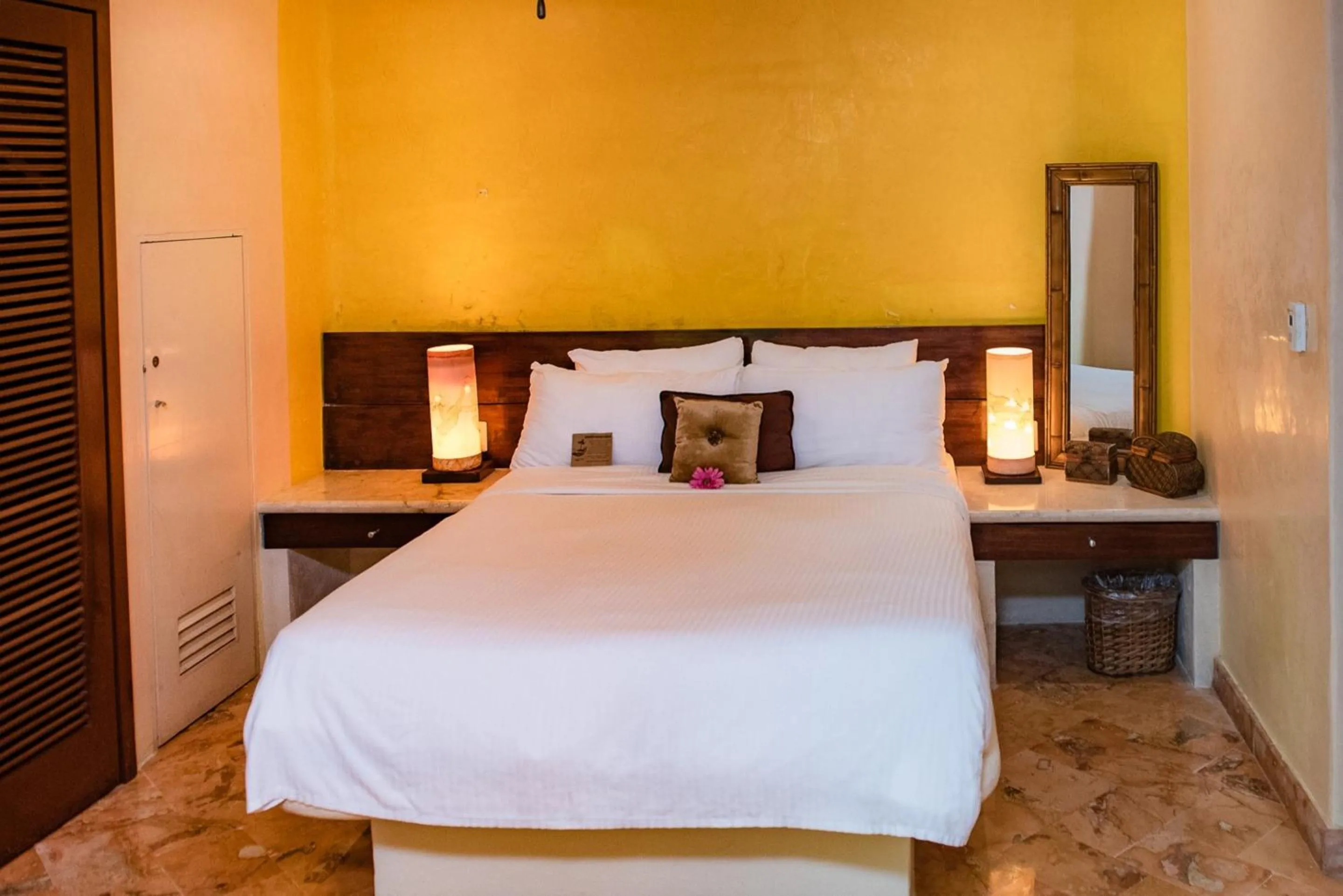 Bed in Villas Sacbe Condo Hotel and Beach Club