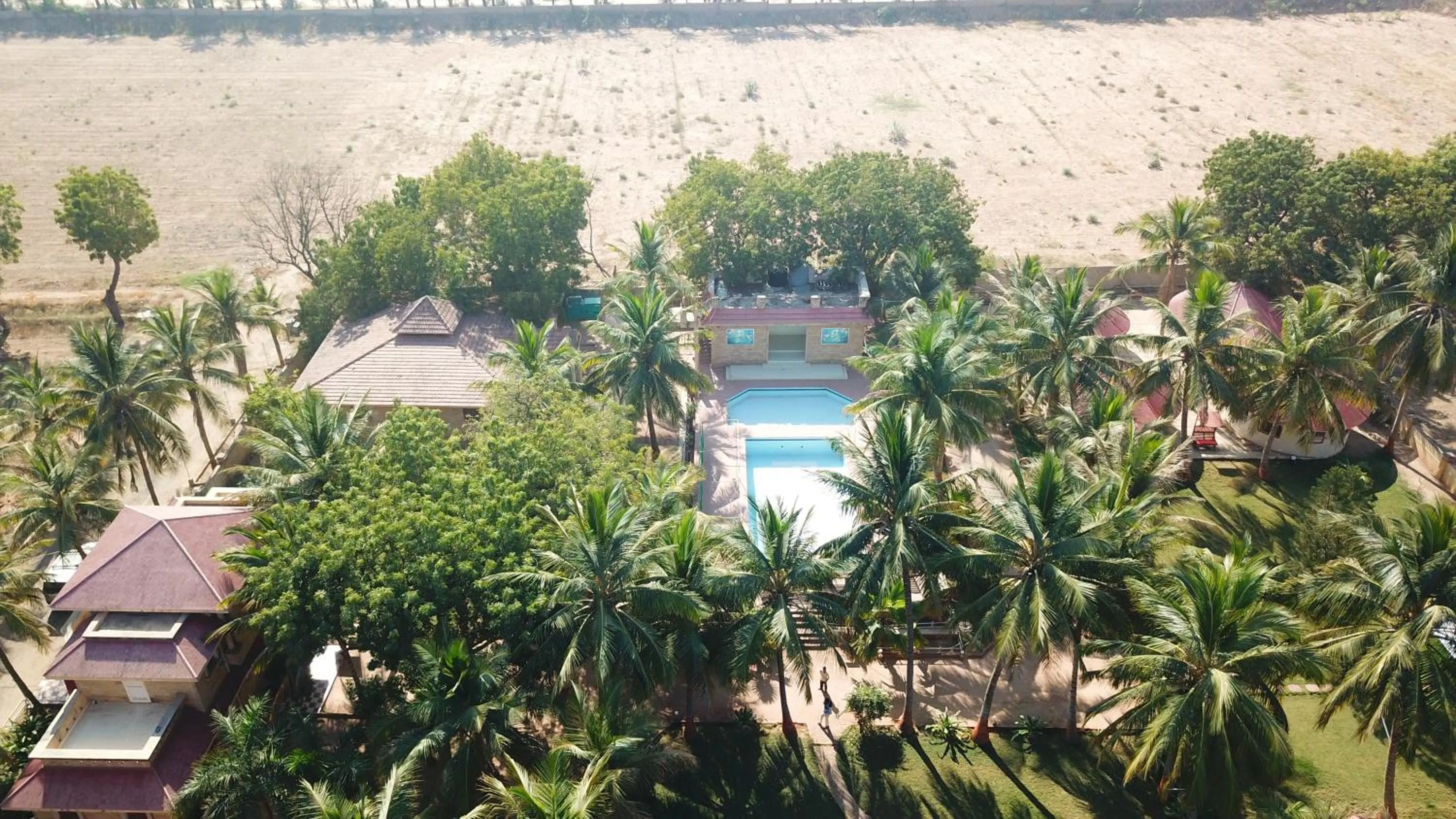 Property building in Stay Guru Resort Farm Villa