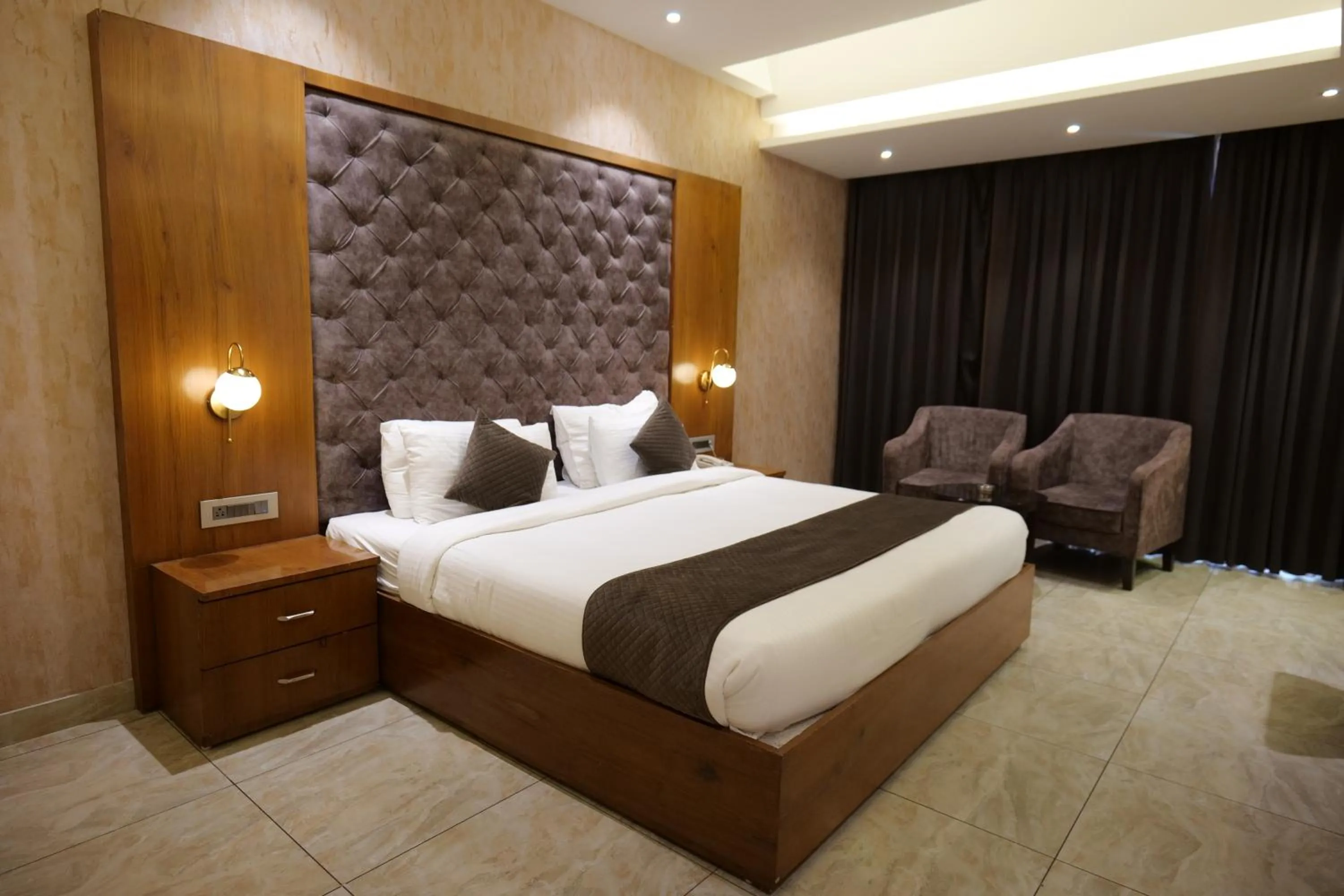 Photo of the whole room, Bed in The Emerald Grand