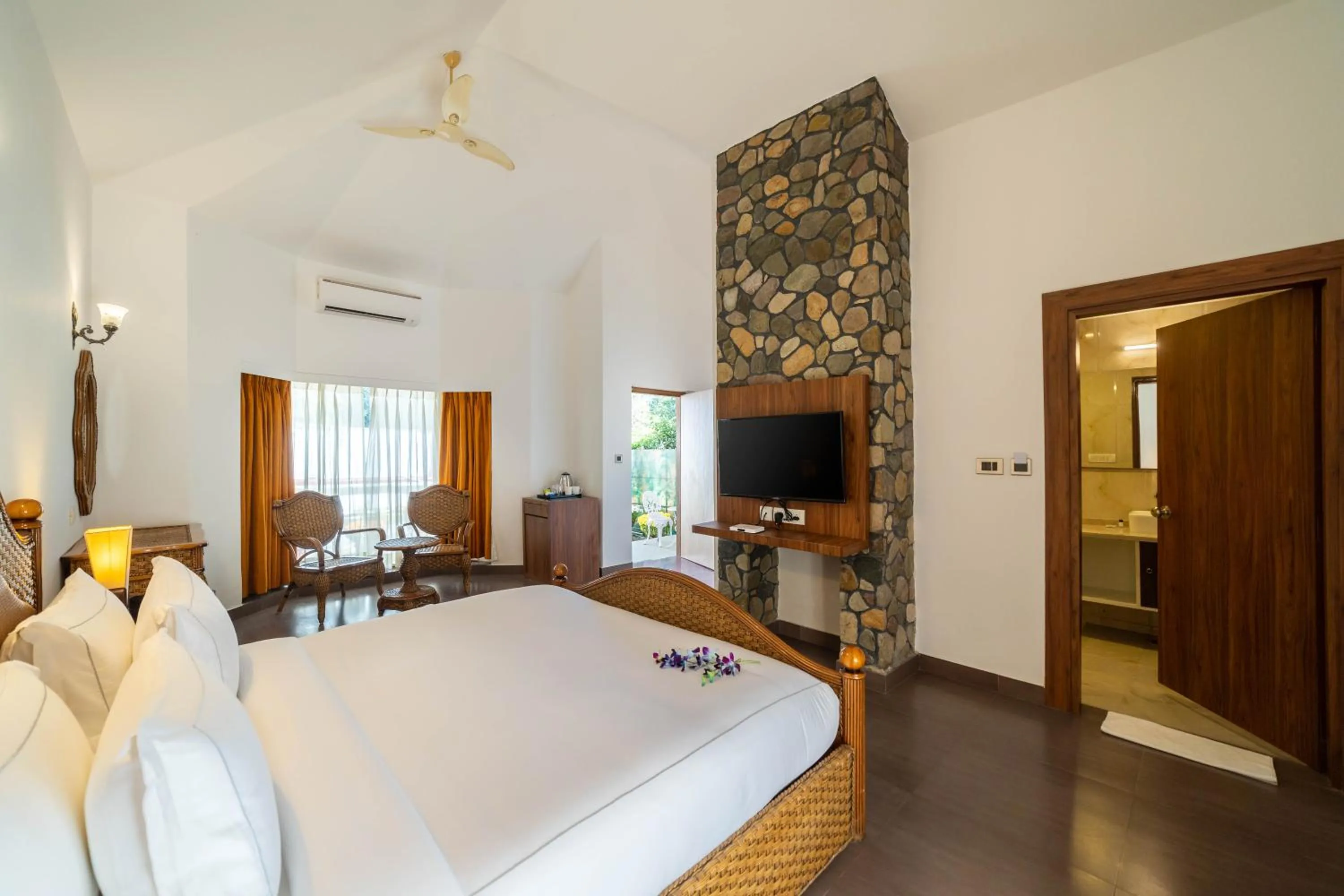 Photo of the whole room, Bed in Country Inn Tarika Riverside Resort Jim Corbett
