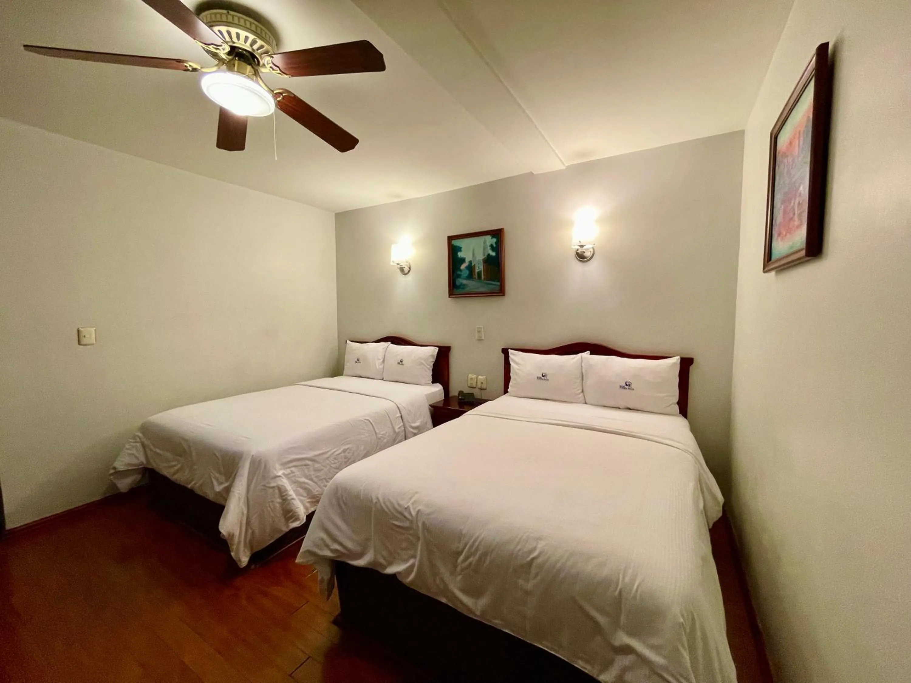 Bed in Hotel Puebla Plaza