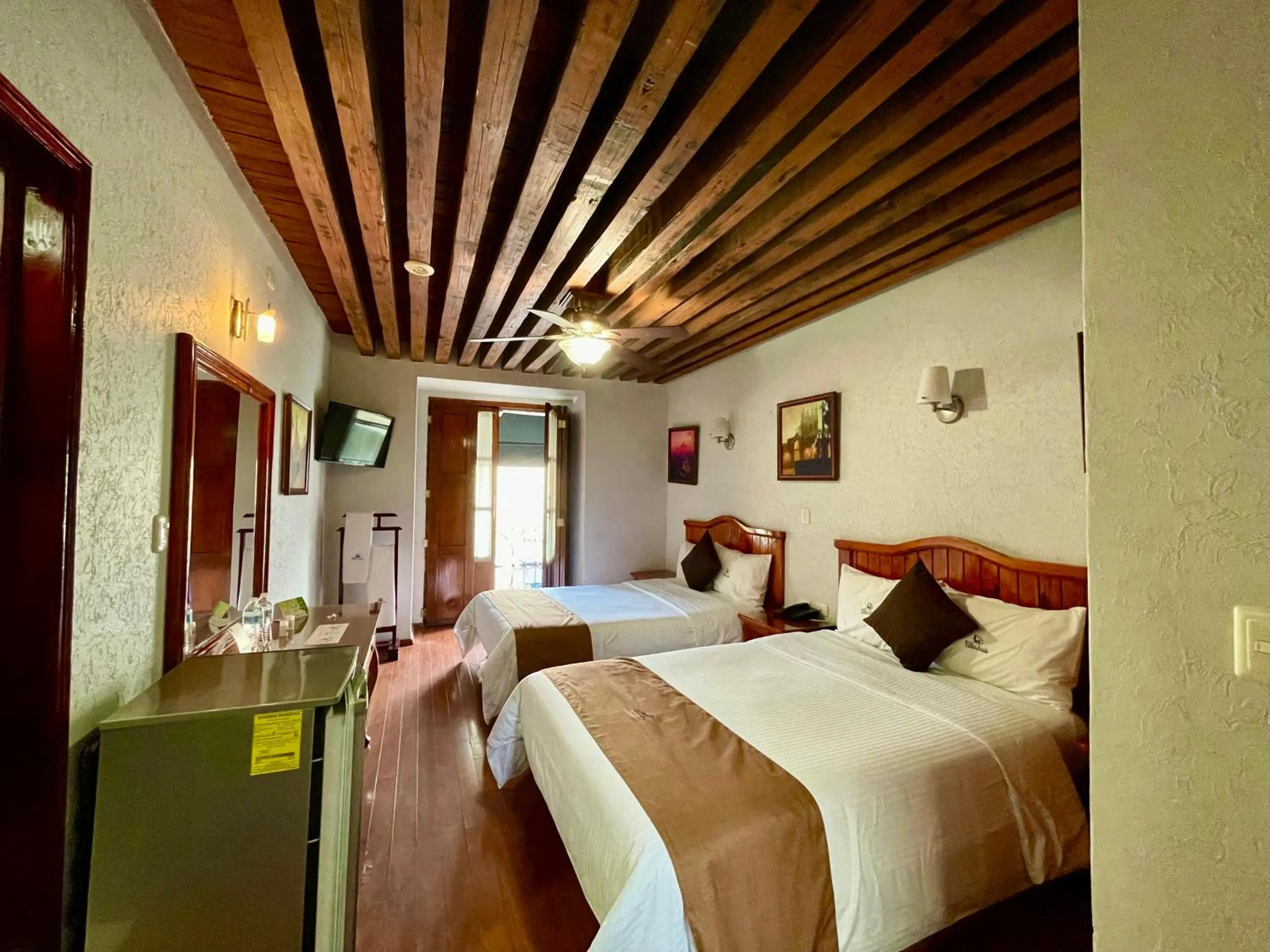 Bed in Hotel Puebla Plaza