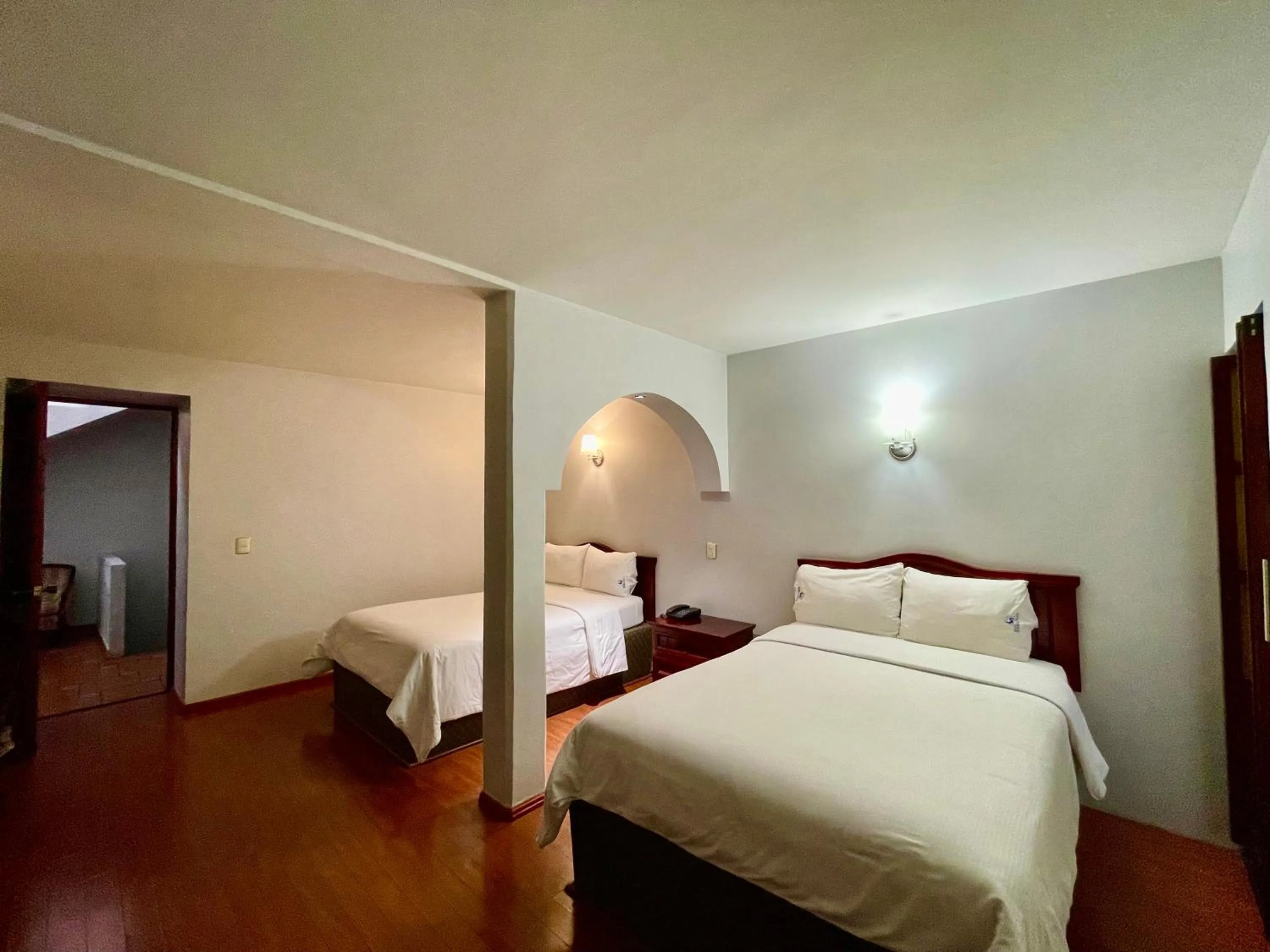 Bed in Hotel Puebla Plaza