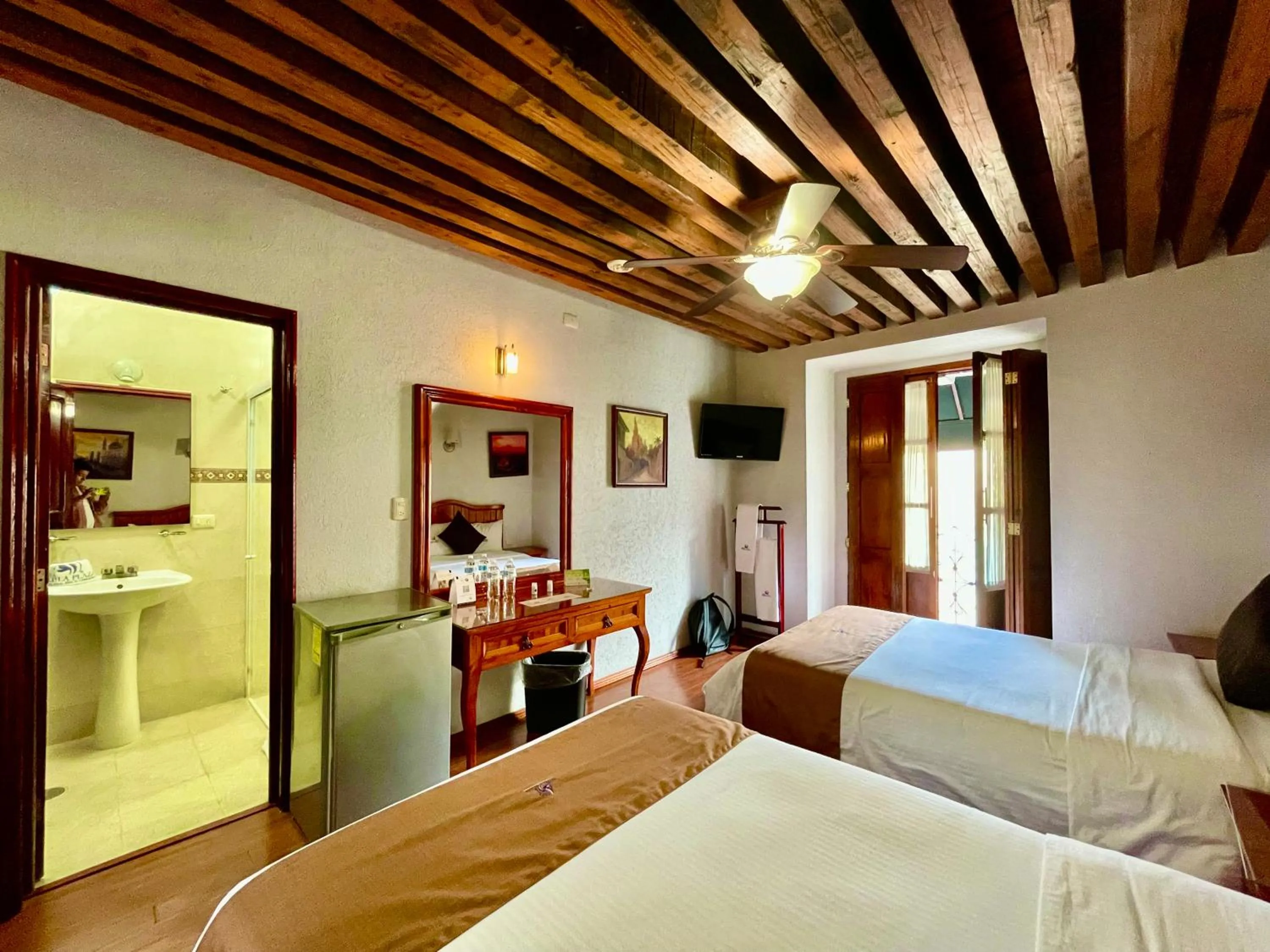 Bed in Hotel Puebla Plaza