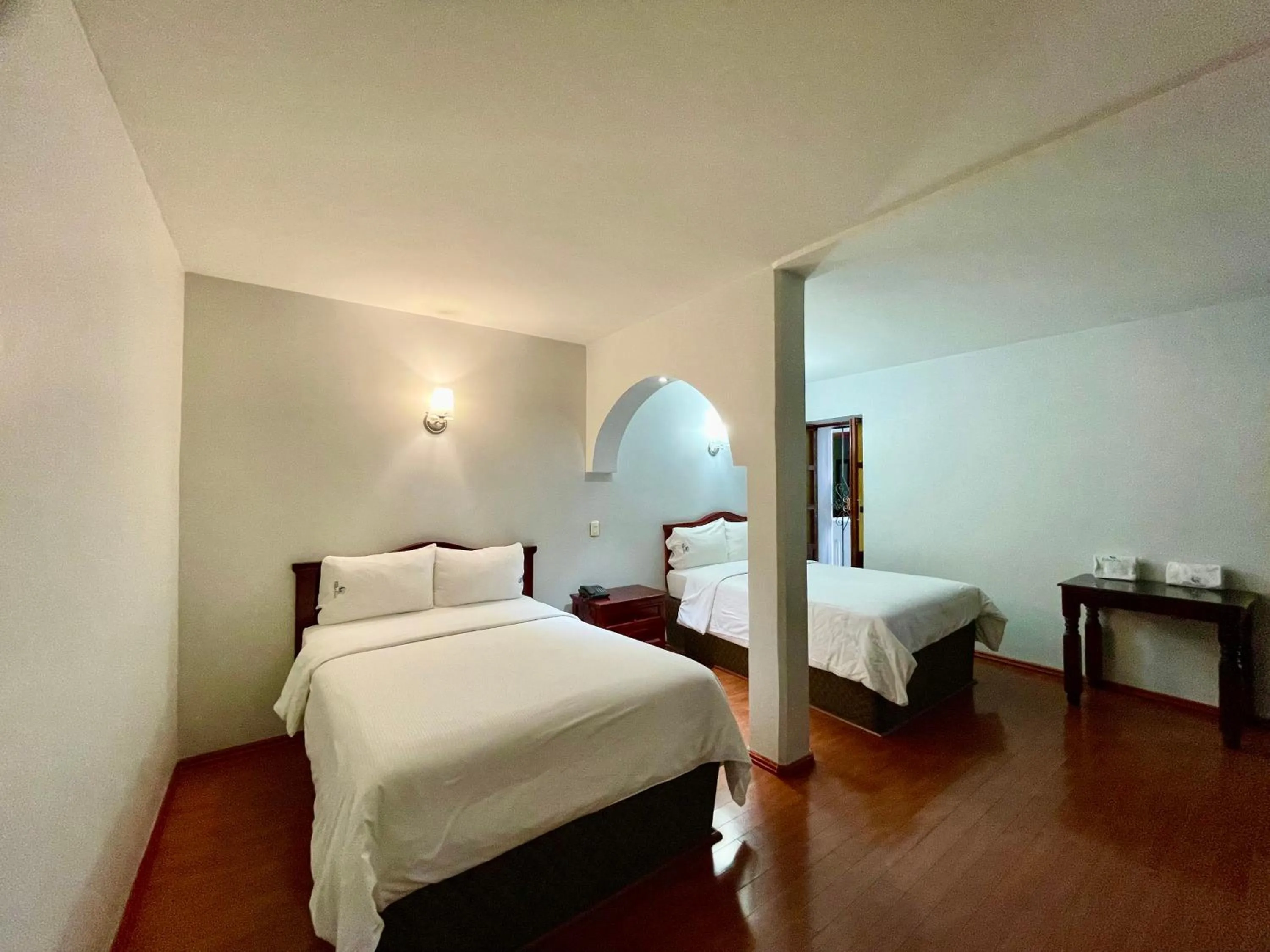 Bed in Hotel Puebla Plaza