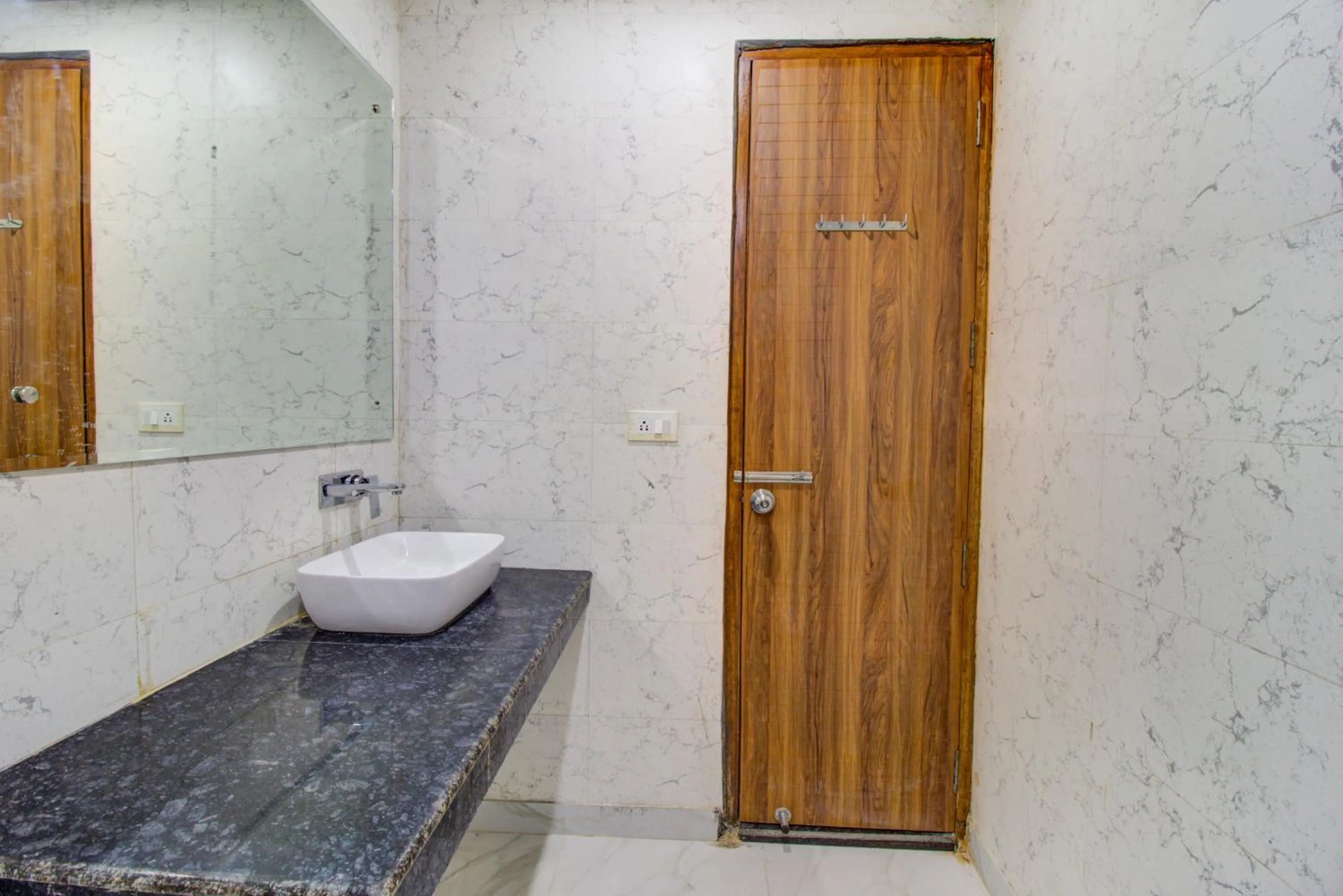 Bathroom in FabHotel Gross inn Suites - Nr IGI Airport New Delhi