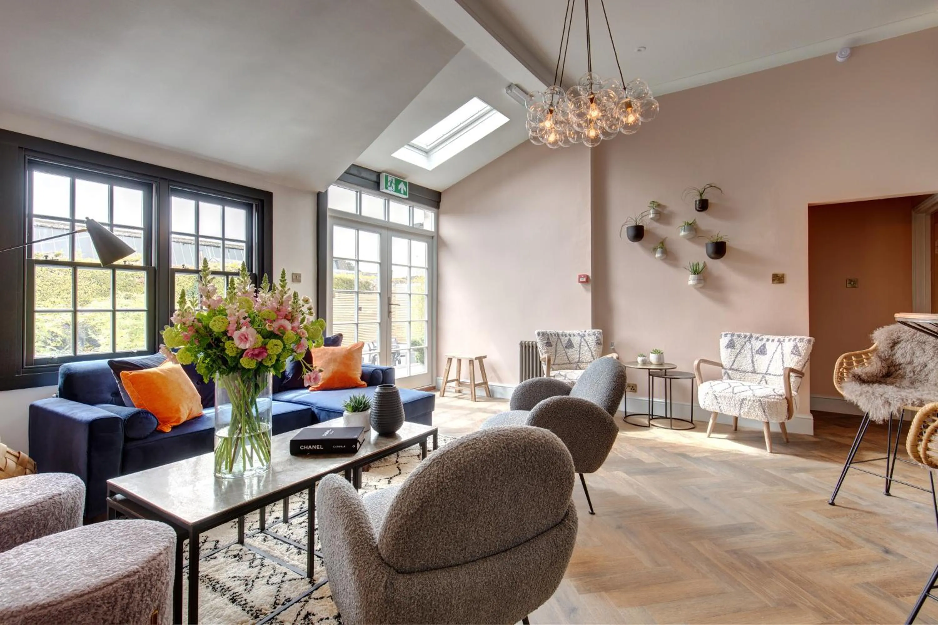 Communal lounge/ TV room in The Railway Hotel by Barefoot Retreats