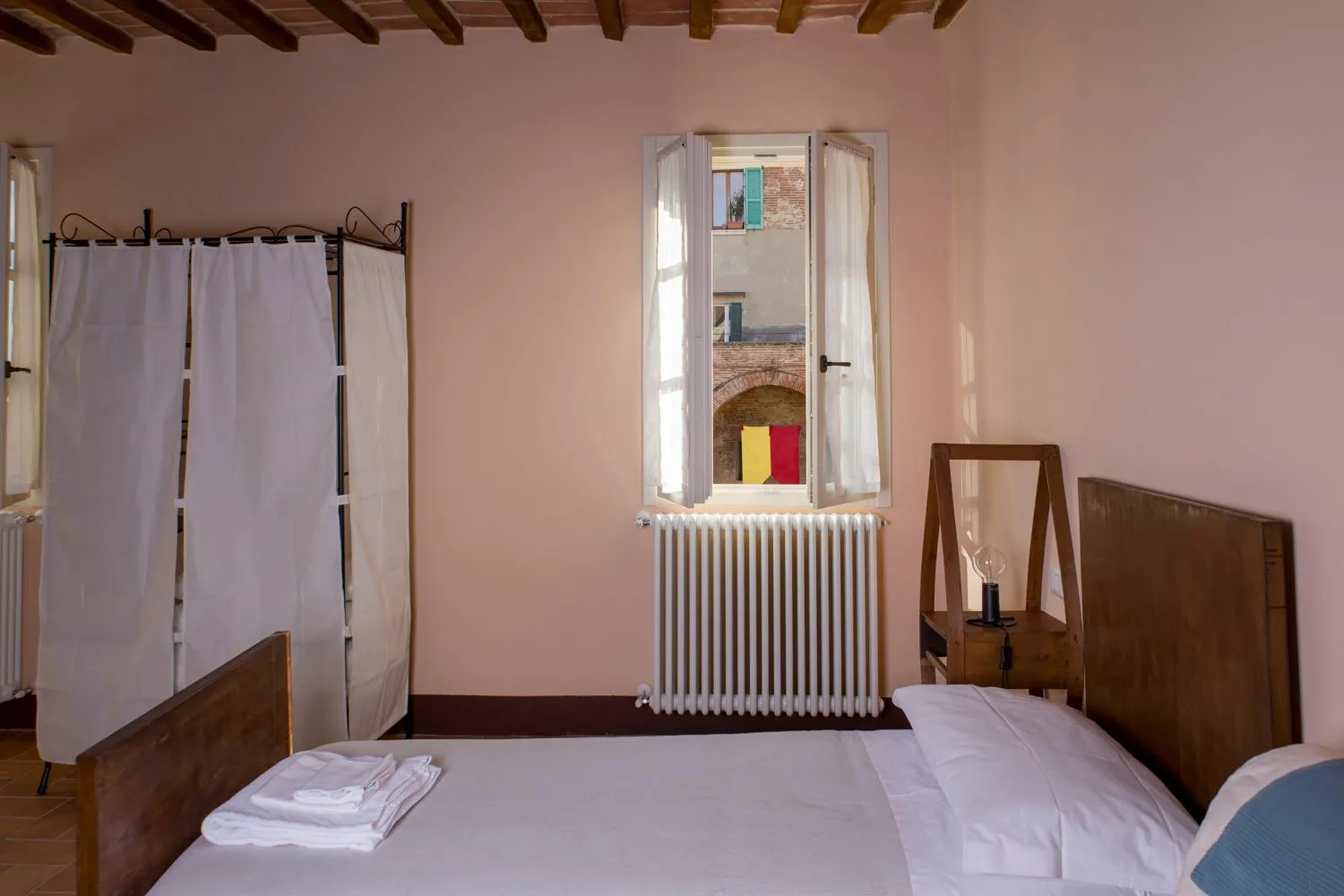 Photo of the whole room, Bed in In Collegiata