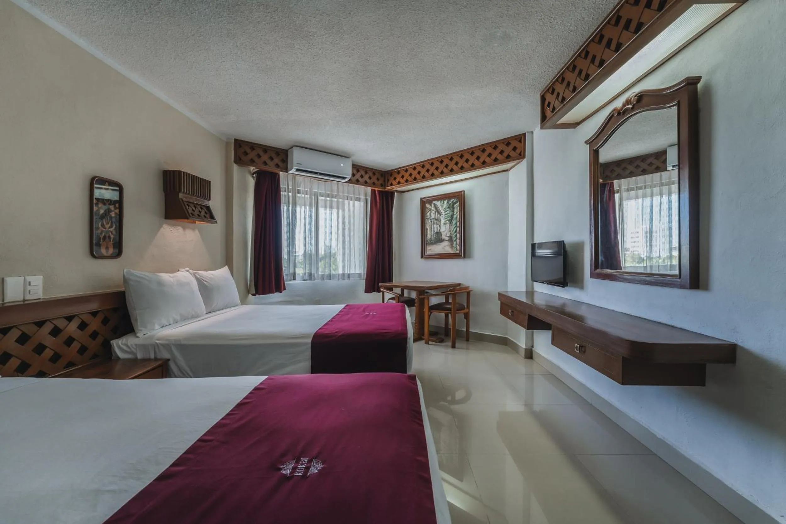 Bed in Hotel Plaza Kokai Cancún