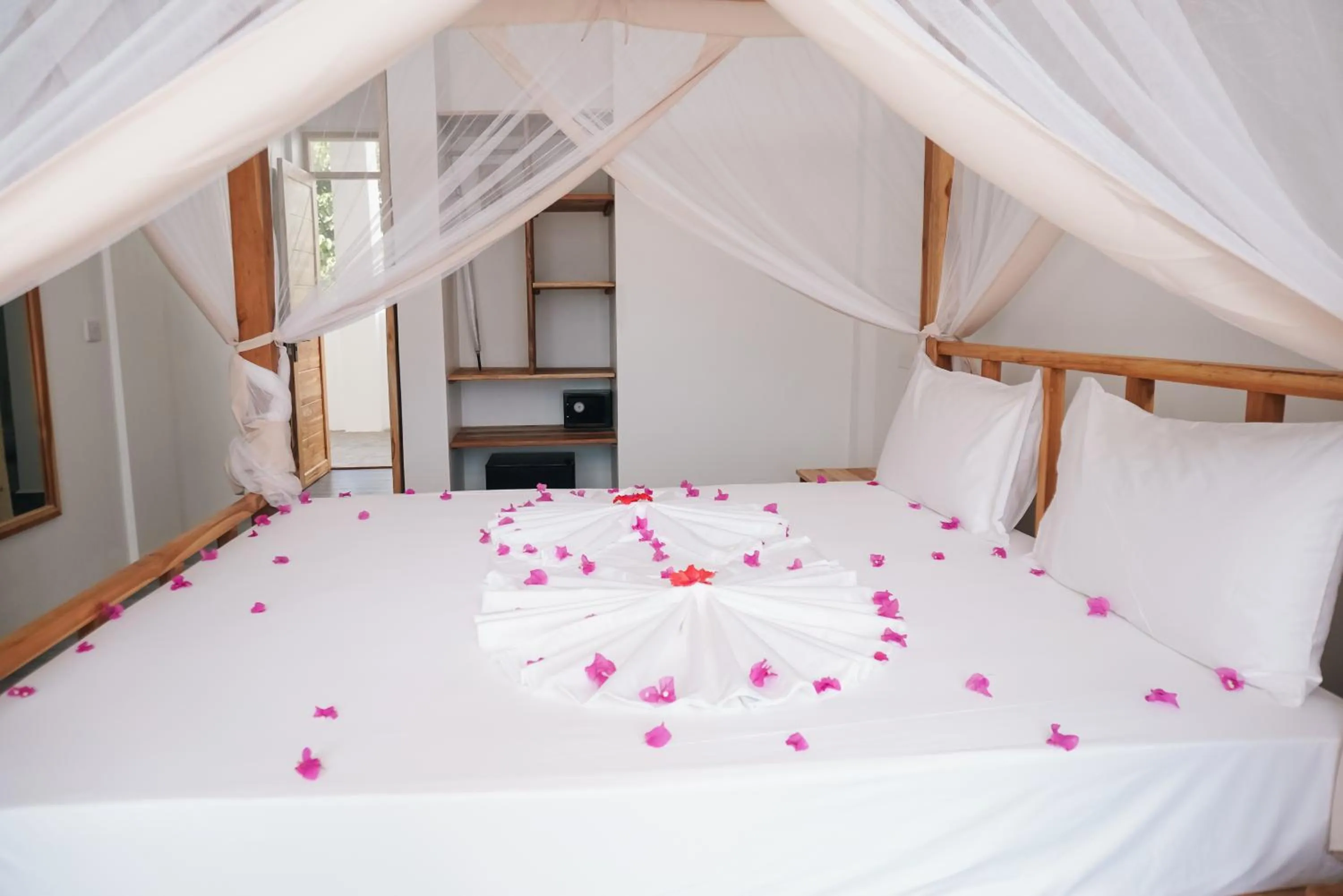 Bed in AHG Sun Bay Mlilile Beach Hotel