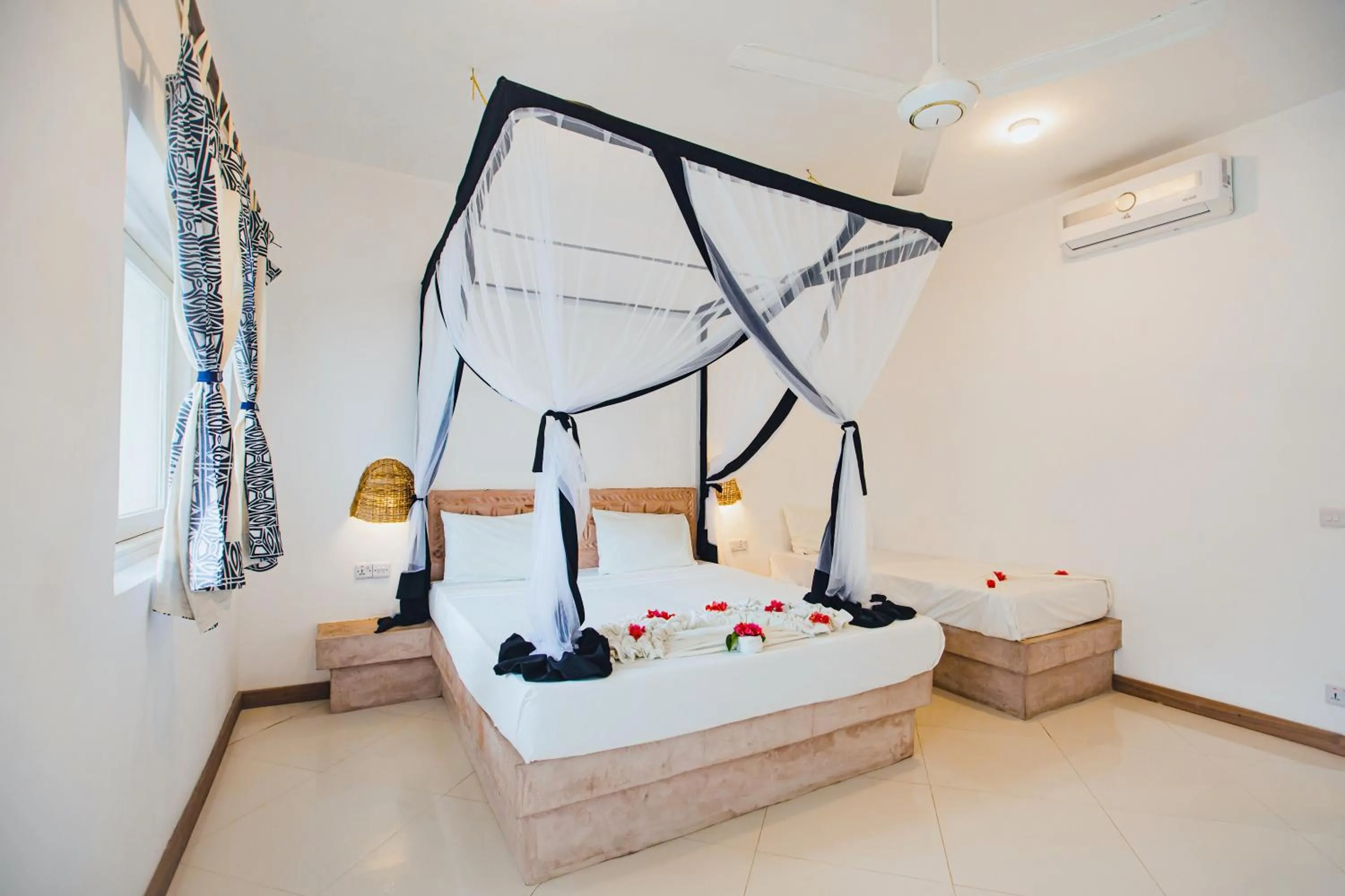 Bed in AHG Sun Bay Mlilile Beach Hotel