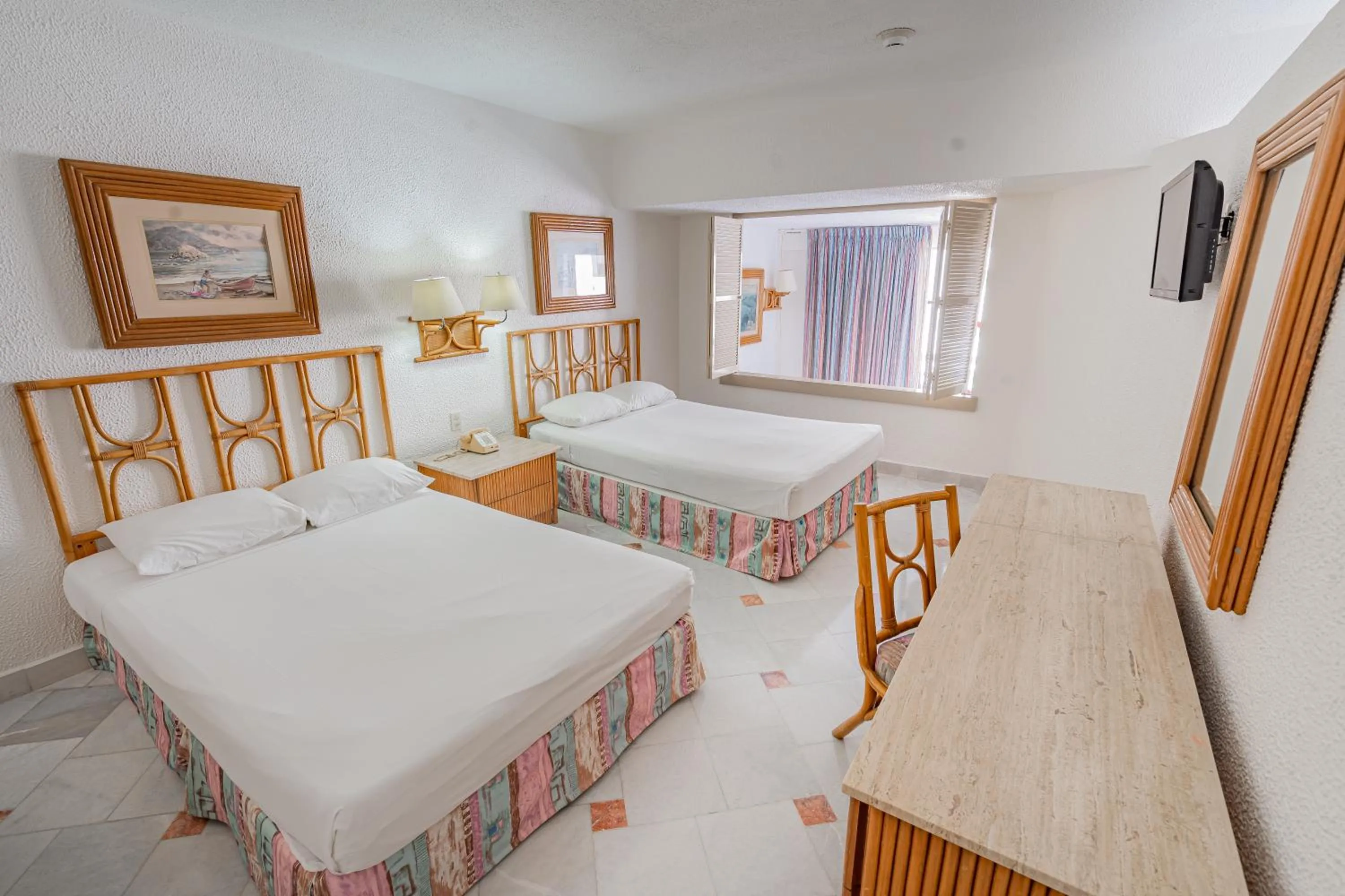 Bed in Playa Suites Acapulco