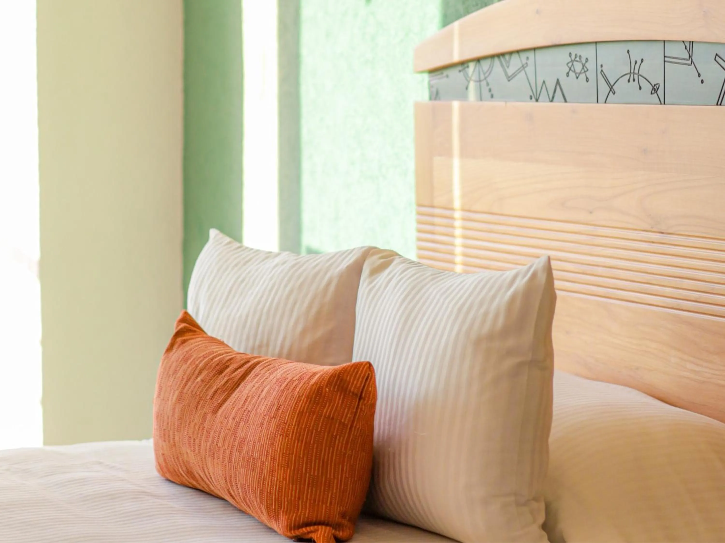 Bed in Hotel Casa Mexicana Cozumel