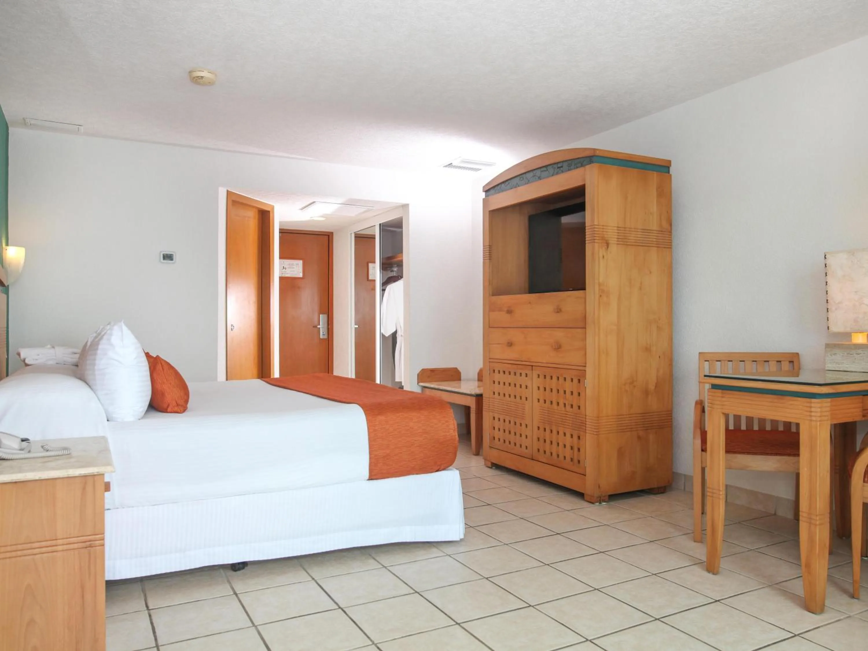 Bed in Hotel Casa Mexicana Cozumel