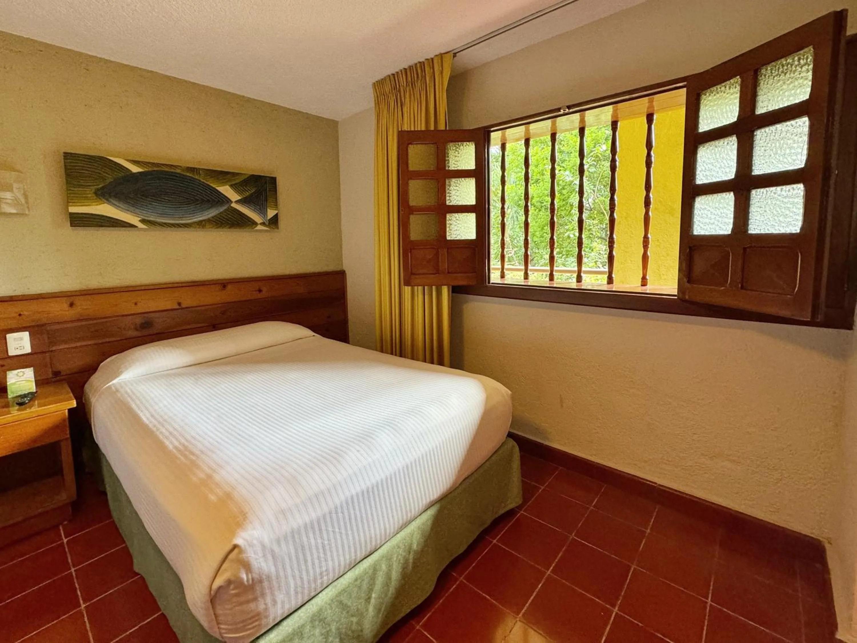 Bed in Hotel Casa Colonial Cozumel