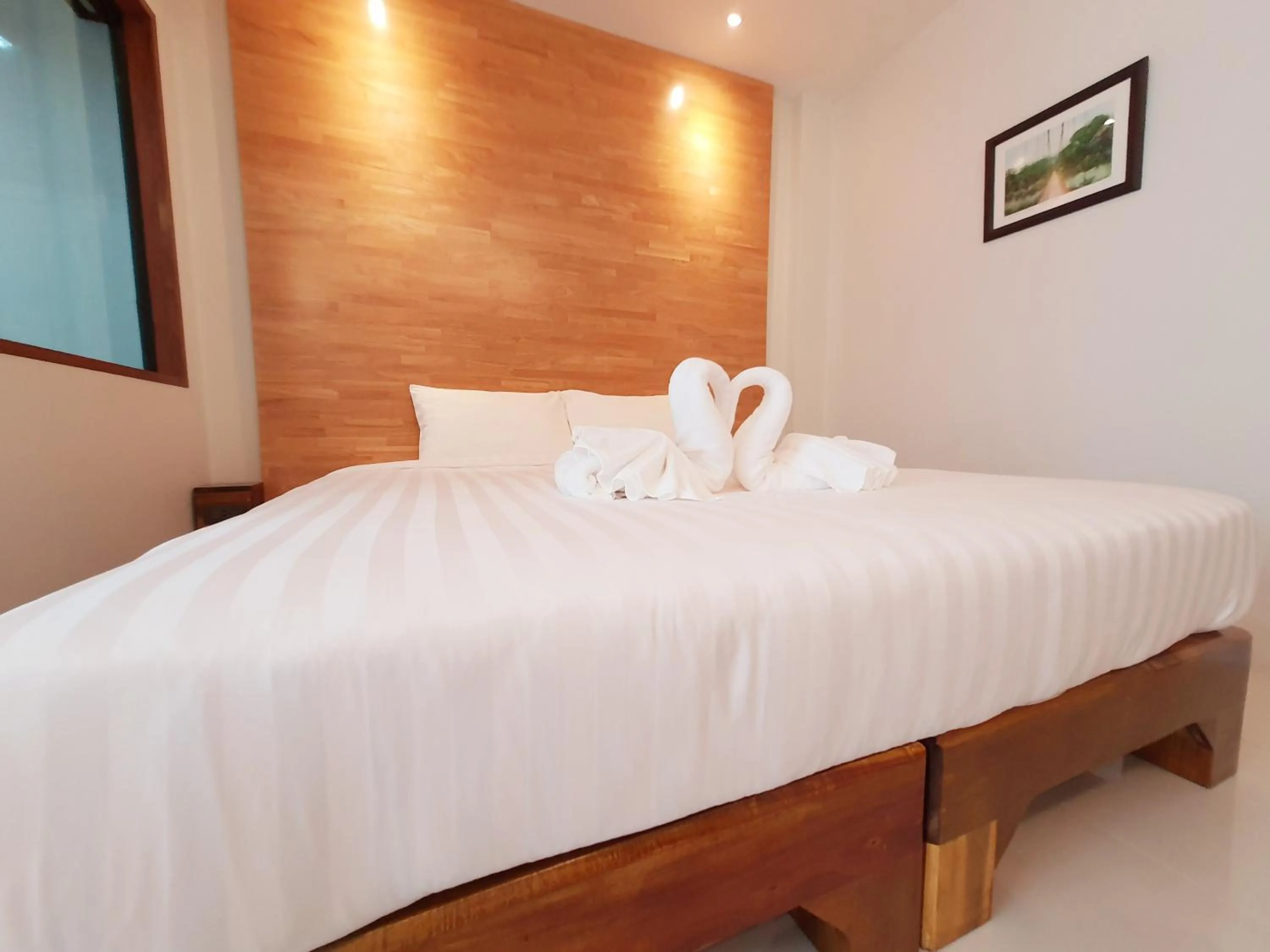 Bed in SUhotel Suratthani