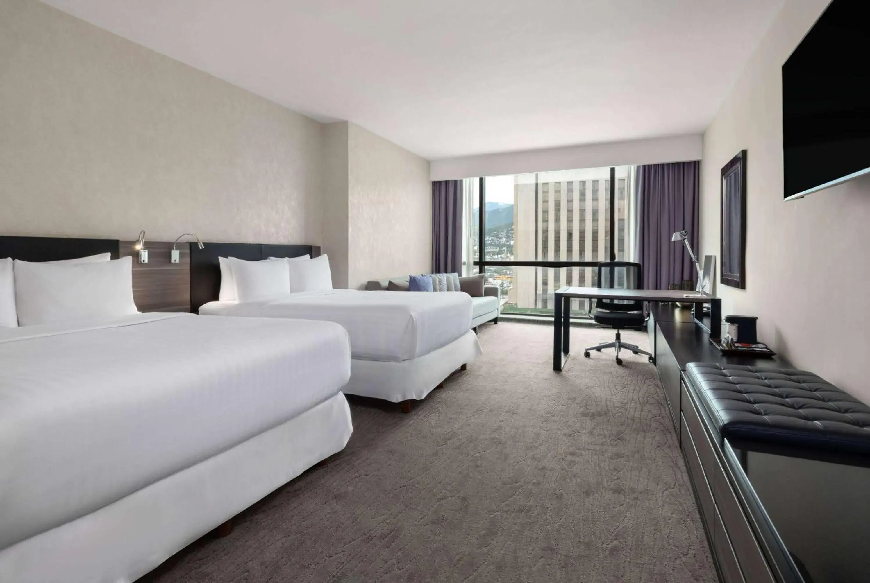 Photo of the whole room, Bed in Wyndham Monterrey Ambassador Centro Photo of the whole room, Bed in Wyndham Monterrey Ambassador Centro