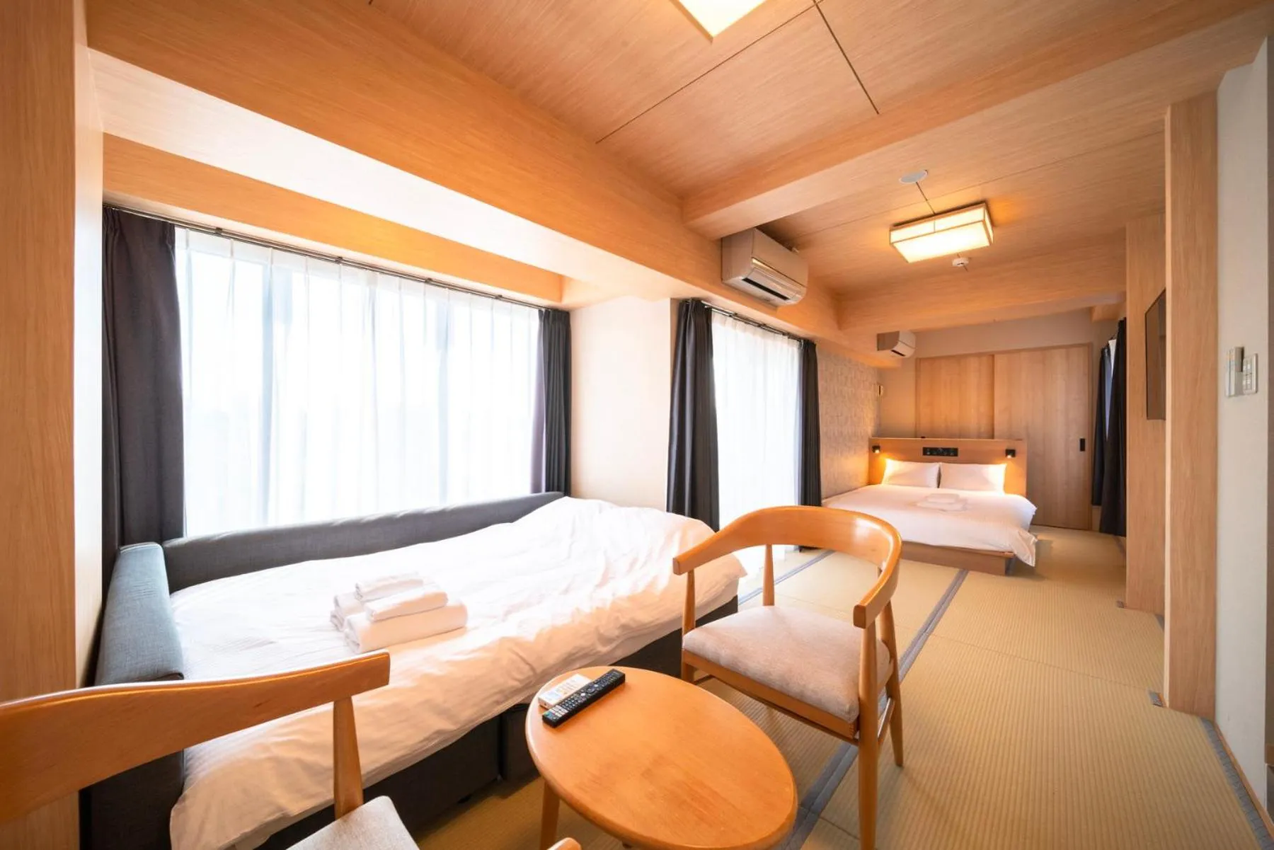 Bed in WELLSTAY Shinsekai Wakyo