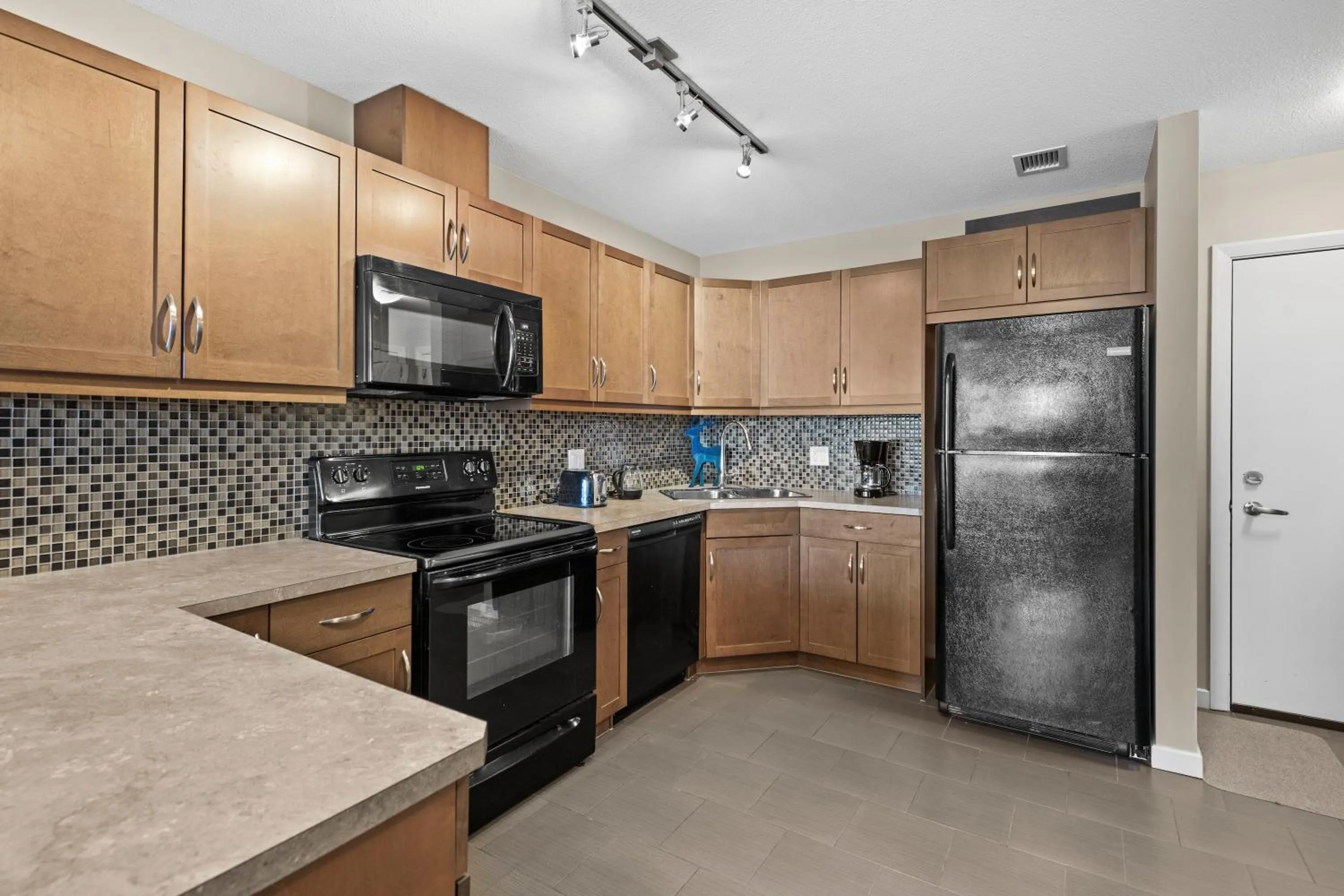 Kitchen or kitchenette in GlobalStay Downtown Calgary Condos