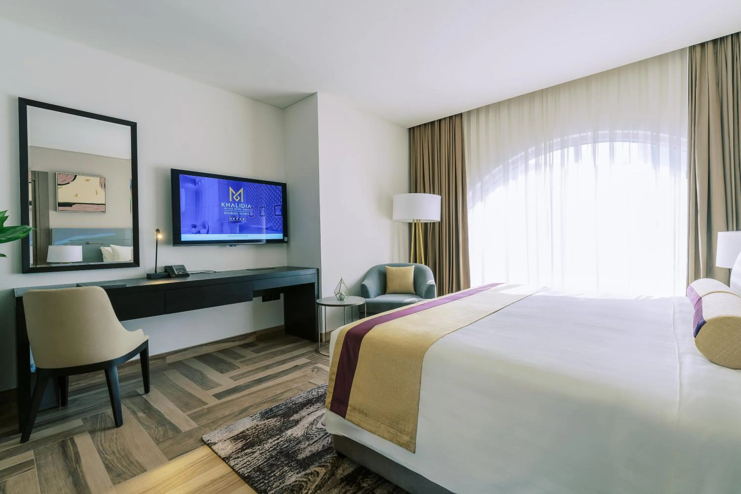 Communal lounge/ TV room, Bed in Khalidia Palace Hotel Dubai by Mourouj Gloria