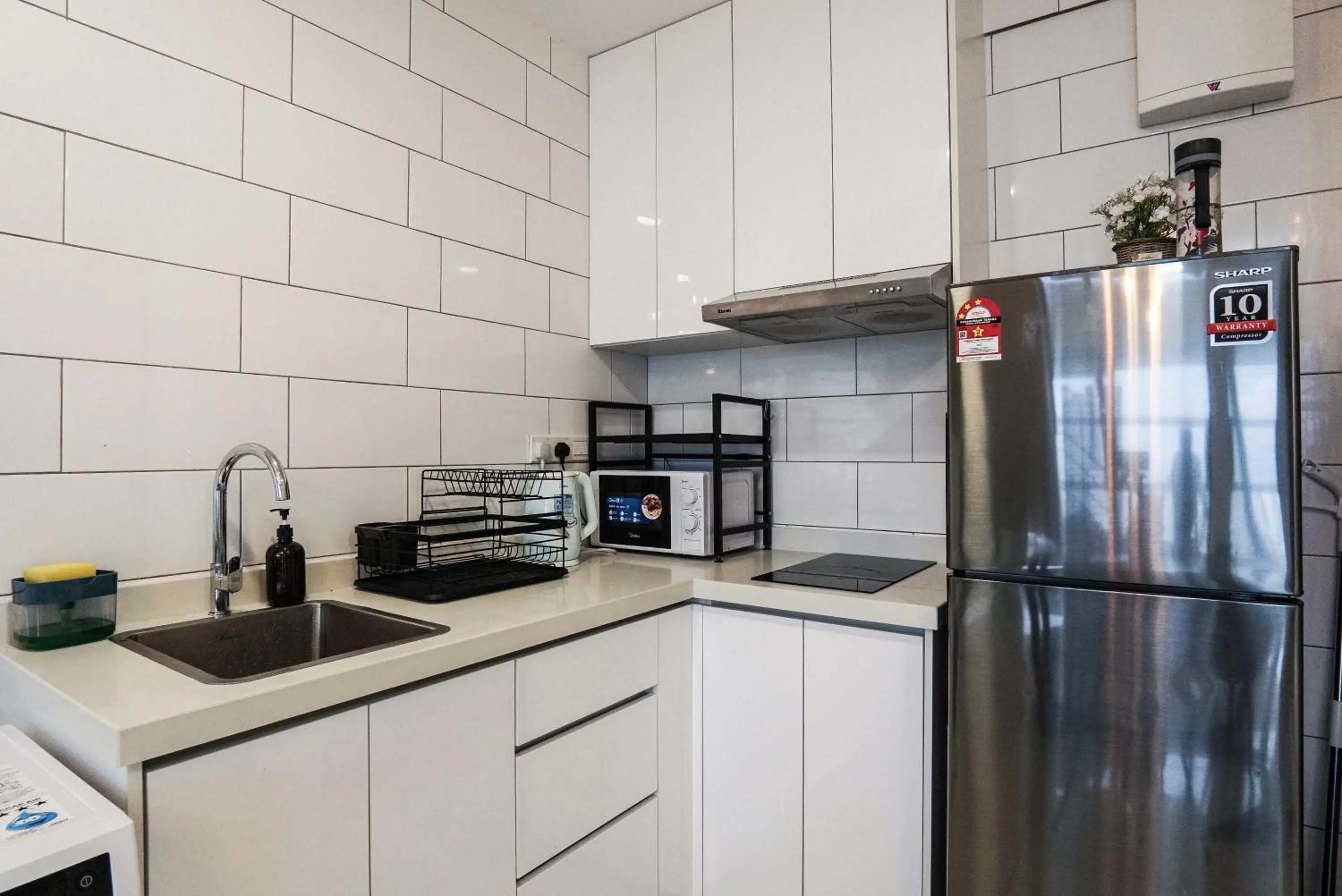 kitchen in Arte Mont Kiara by Airhost