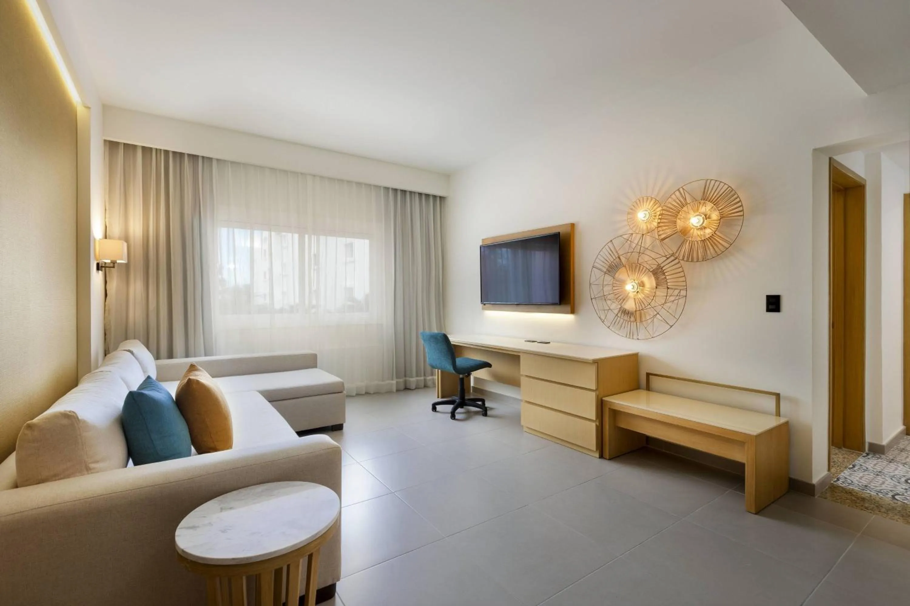 Living room, Bed in Courtyard by Marriott Cancun Airport