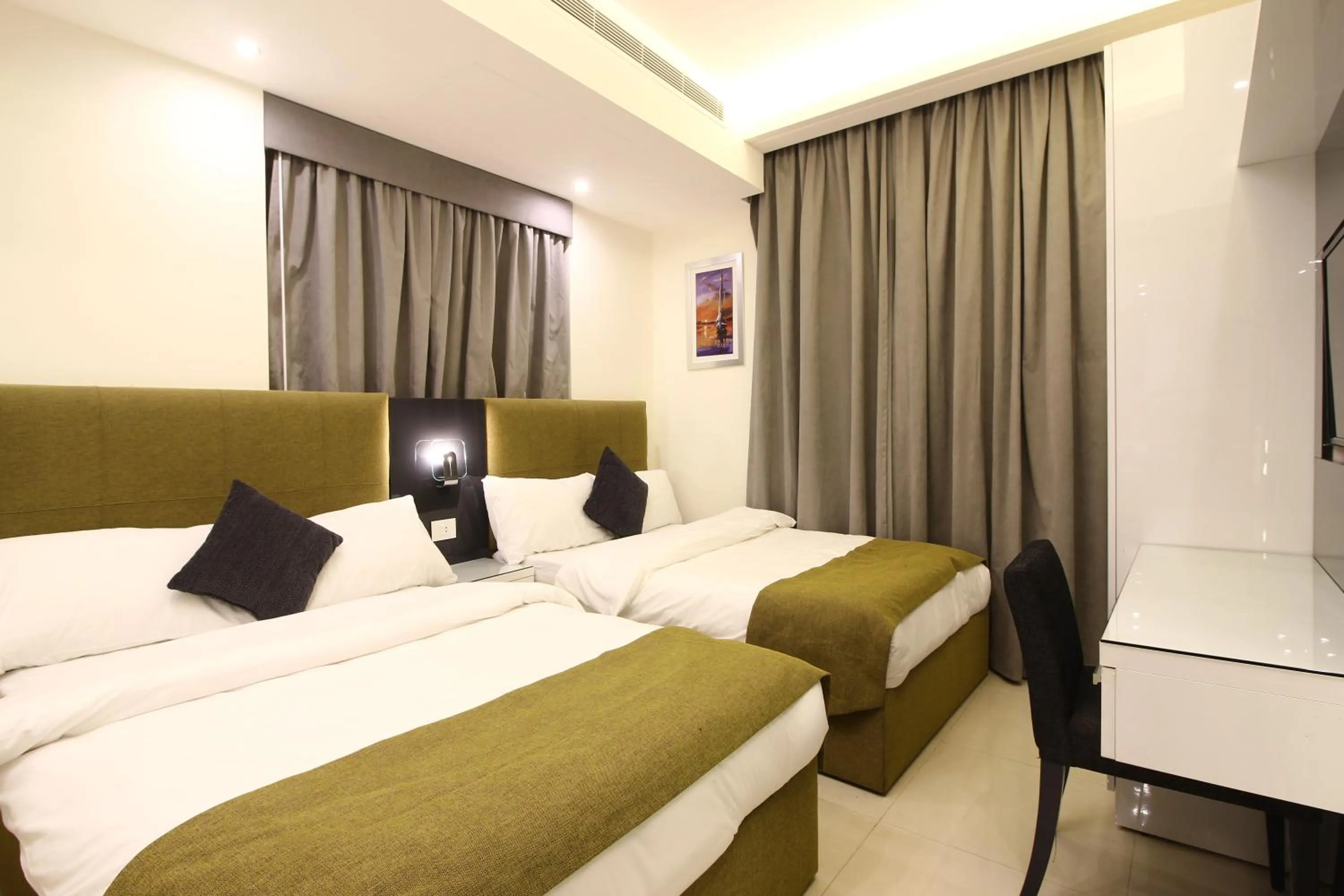 Bed in Palm Ville Suites