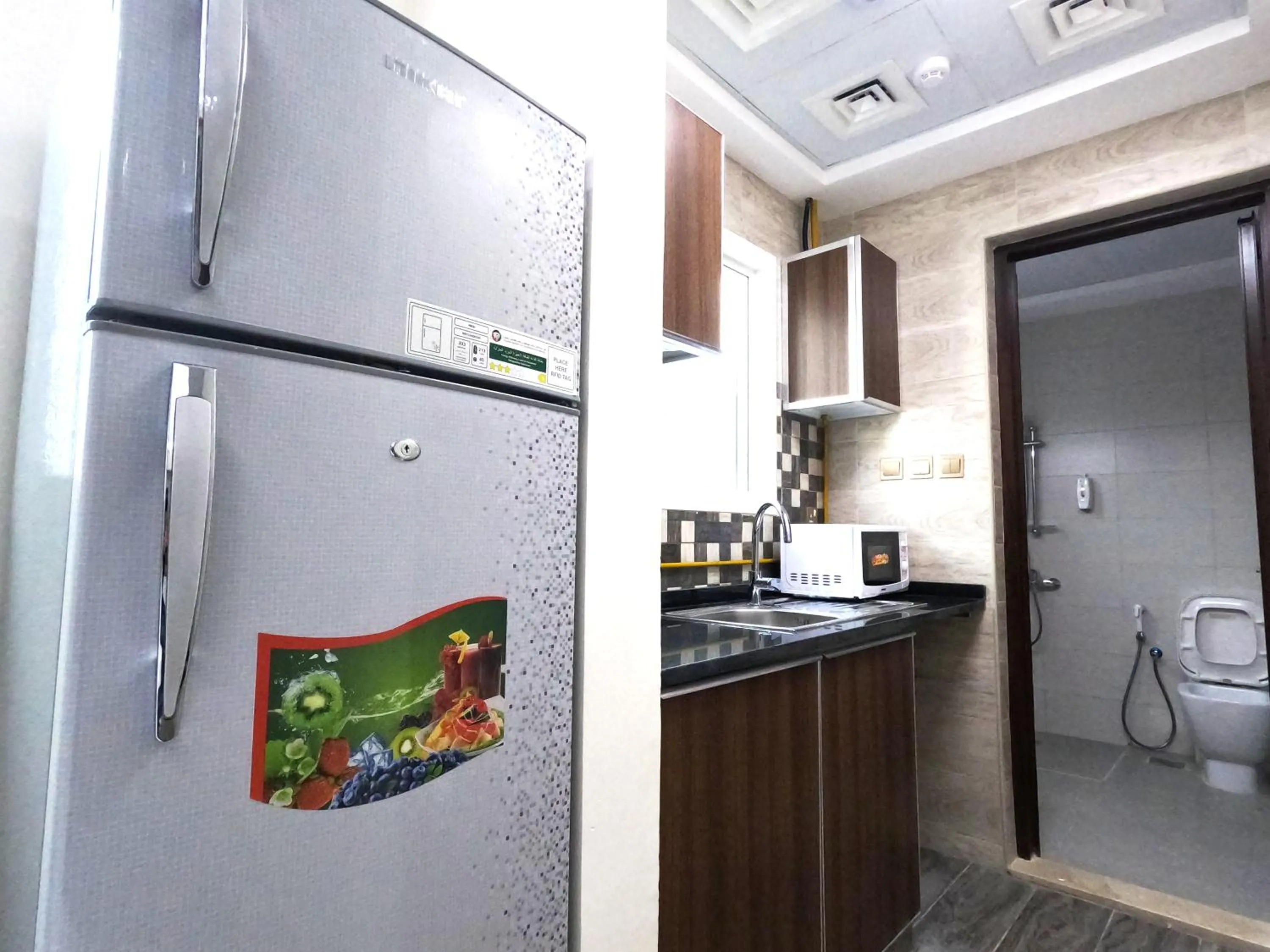 Kitchen or kitchenette in Barsha Star Residence - Home Stay