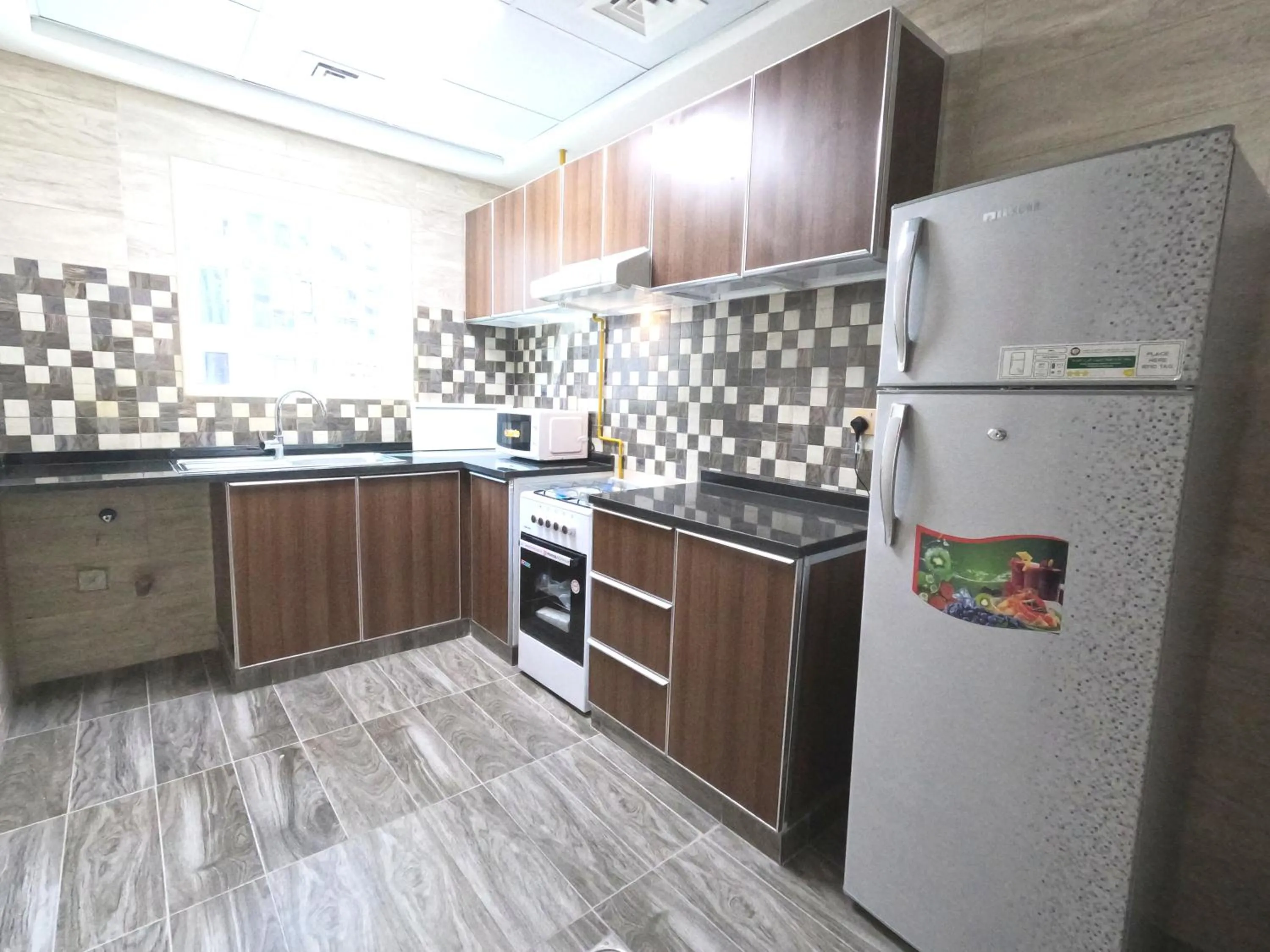 Communal kitchen in Barsha Star Residence - Home Stay