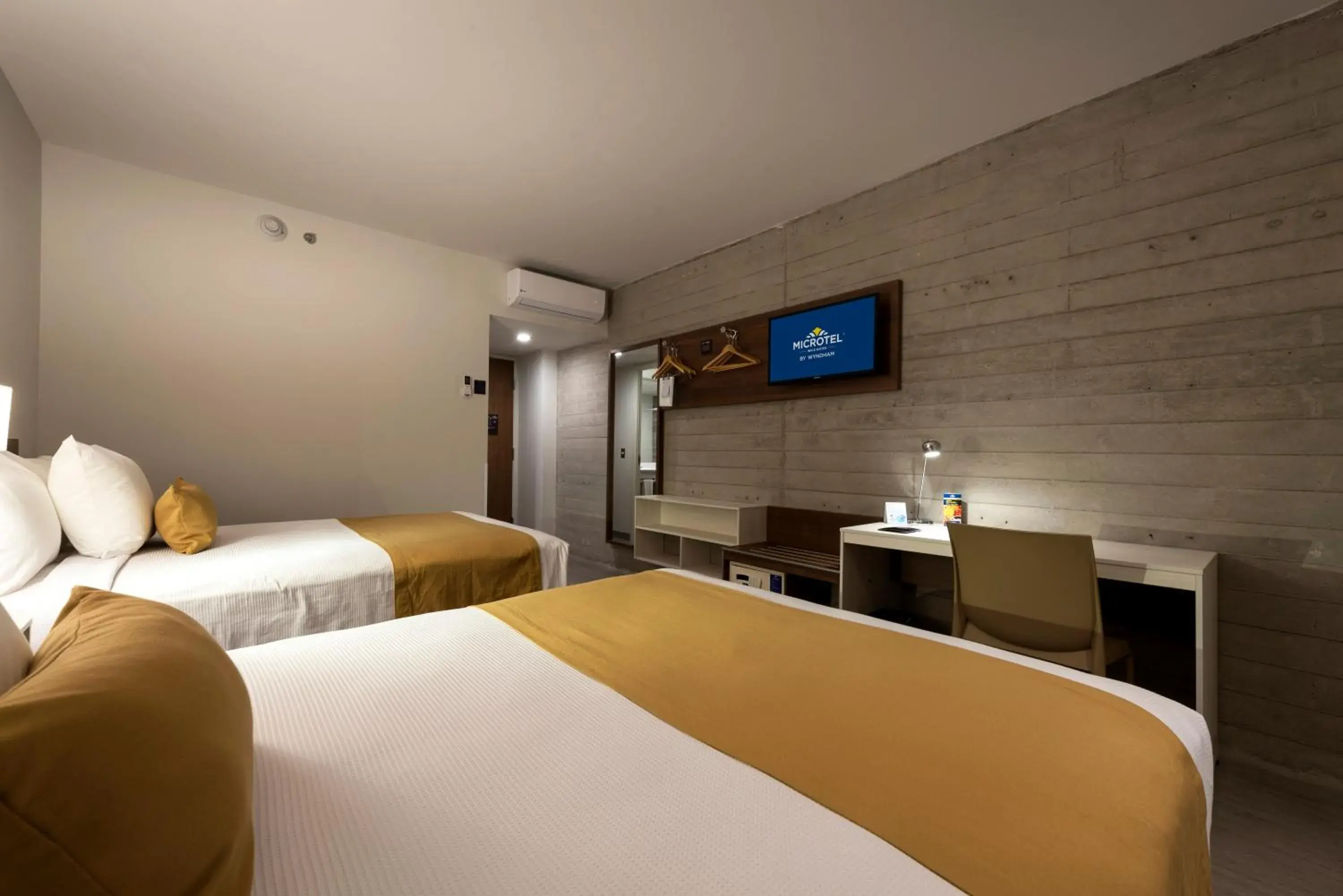Bed in Microtel Inn & Suites by Wyndham Guadalajara Sur Bed in Microtel Inn & Suites by Wyndham Guadalajara Sur