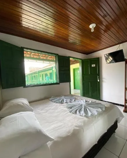 Bed in Pousada Tapuia