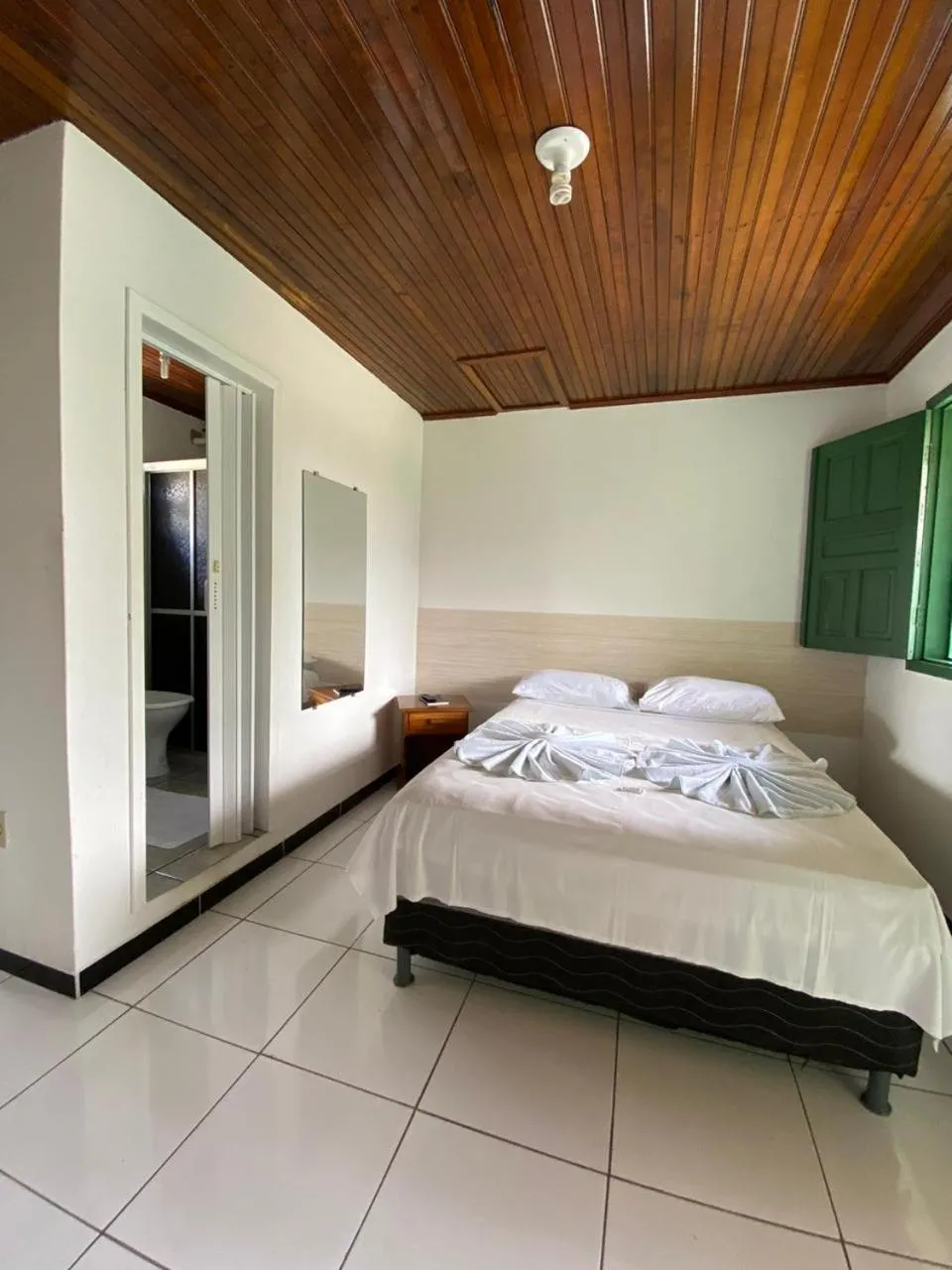 Bed in Pousada Tapuia