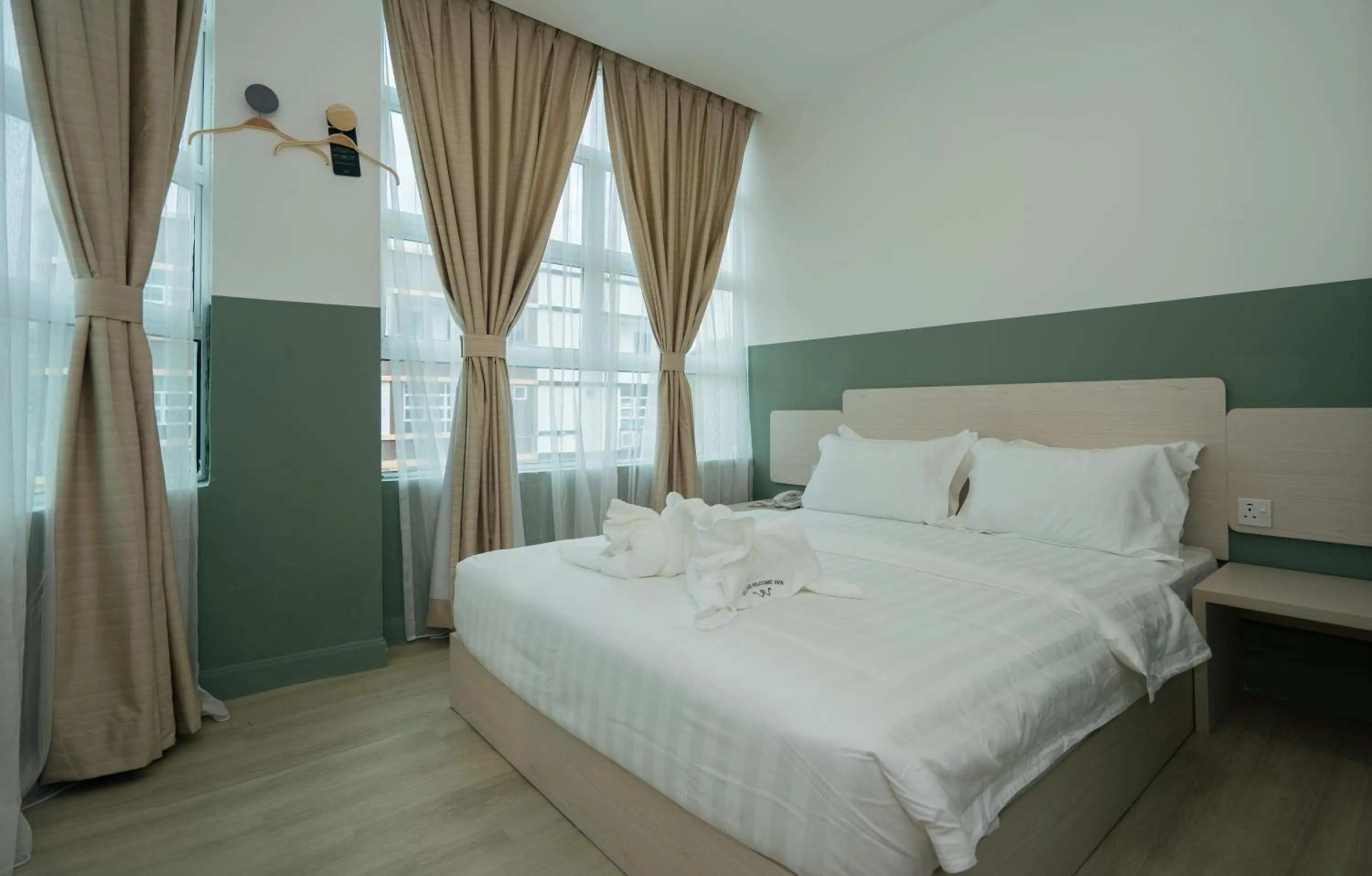 Bed in All Are Welcome Lawas Boutique Hotel