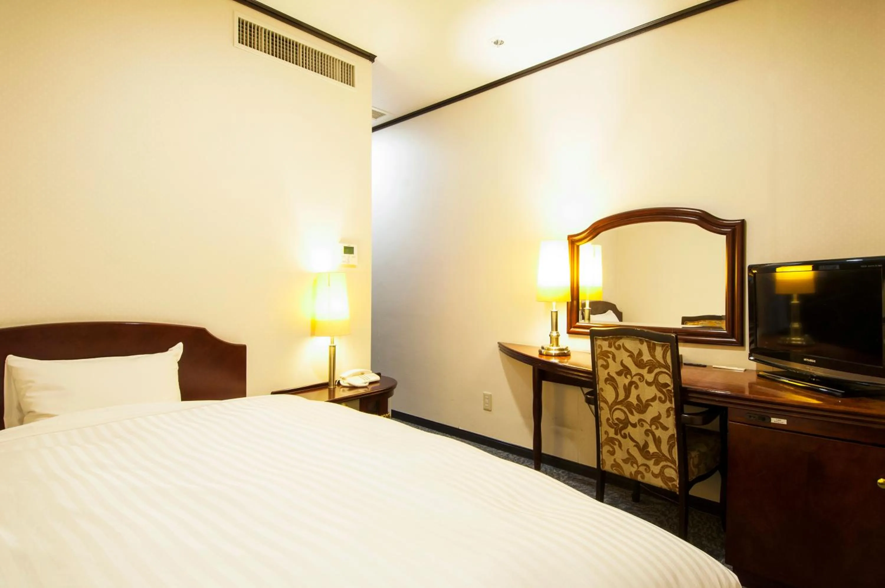 Bed in TsukubaNoYu Urban Hotel