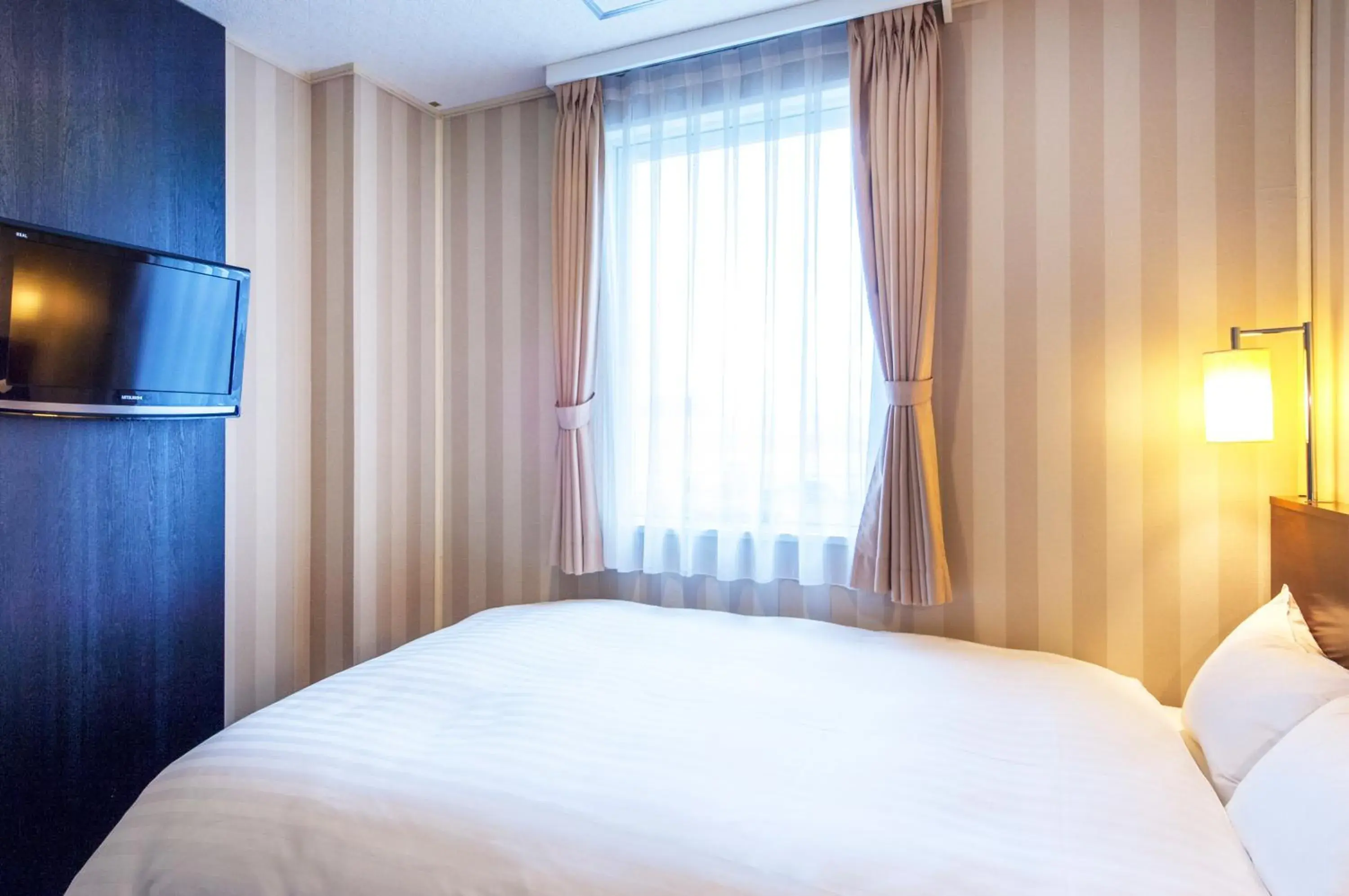 Bed in TsukubaNoYu Urban Hotel Bed in TsukubaNoYu Urban Hotel