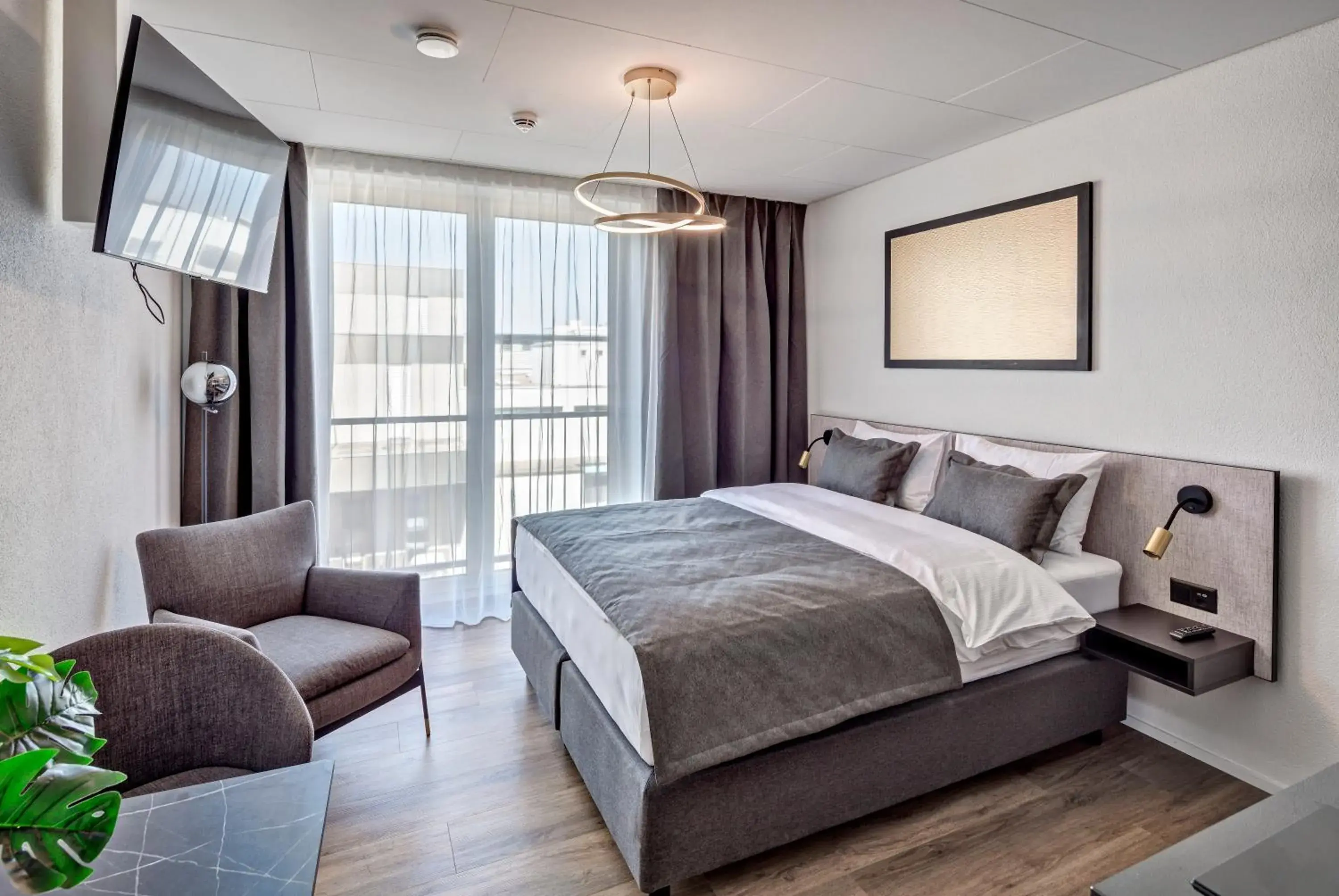 Photo of the whole room, Bed in MOOI Apartments Schlieren Photo of the whole room, Bed in MOOI Apartments Schlieren