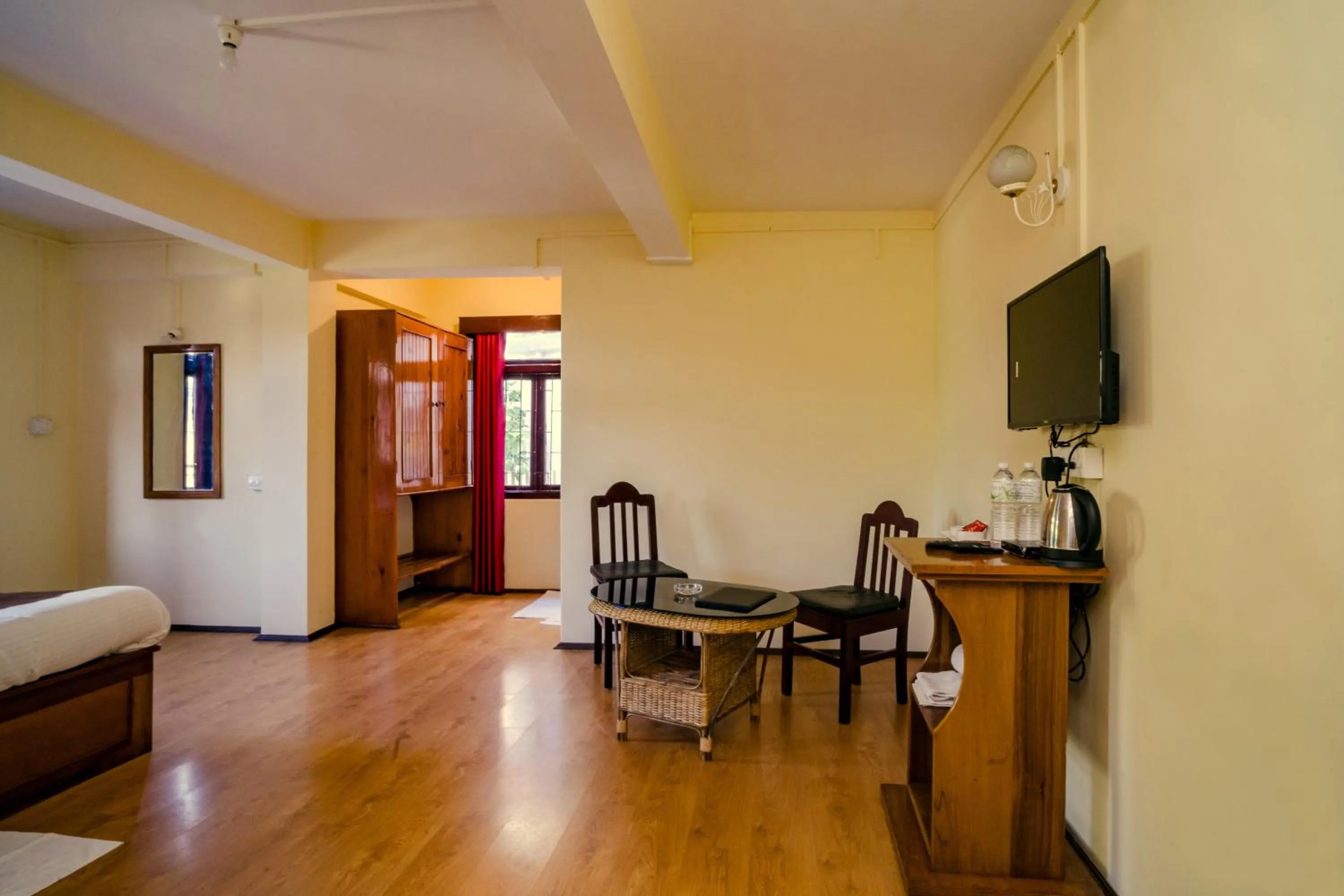 Communal lounge/ TV room in Magpie Mall Road Residency (MG Marg)