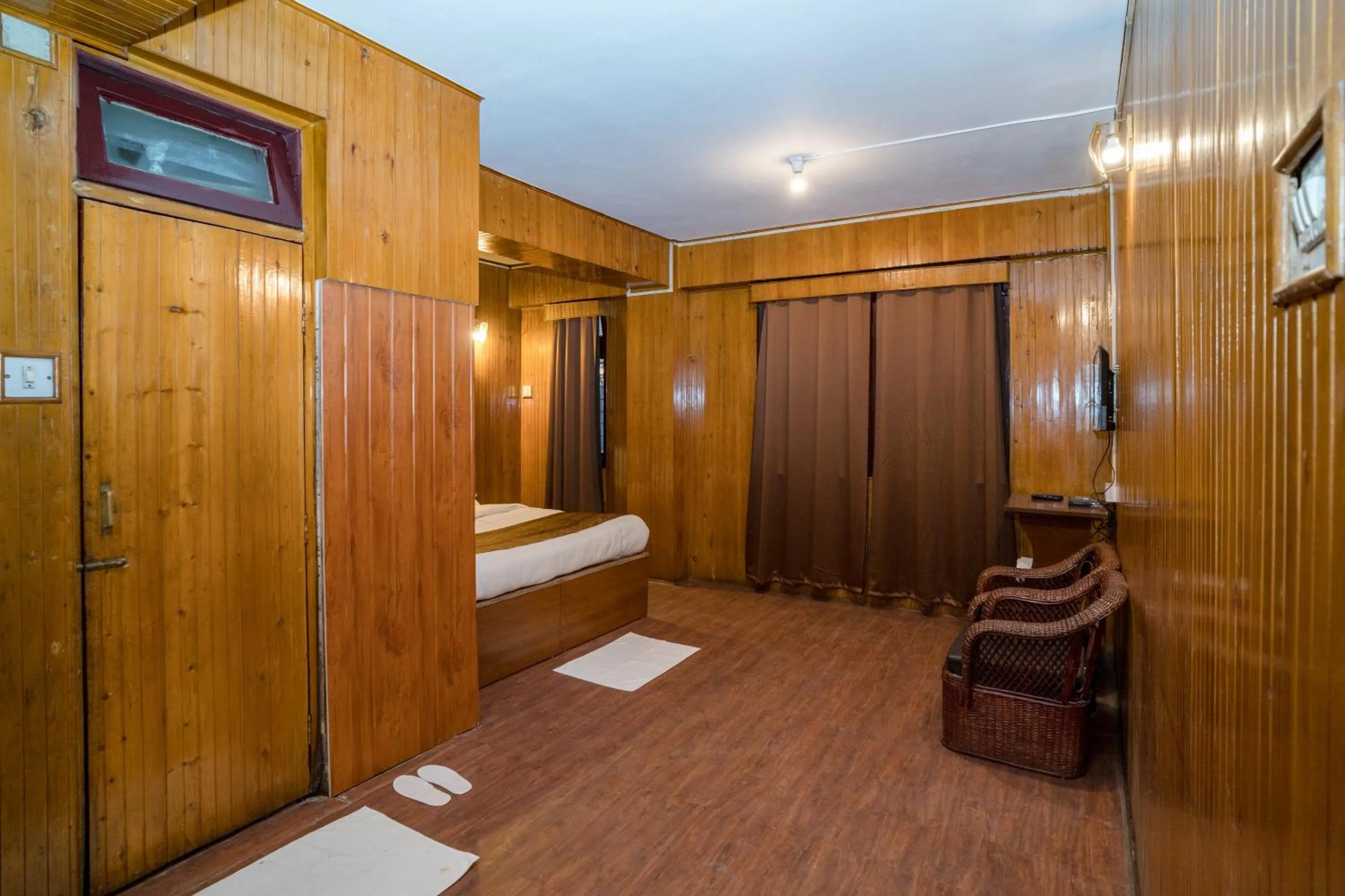 Bedroom in Magpie Mall Road Residency (MG Marg)