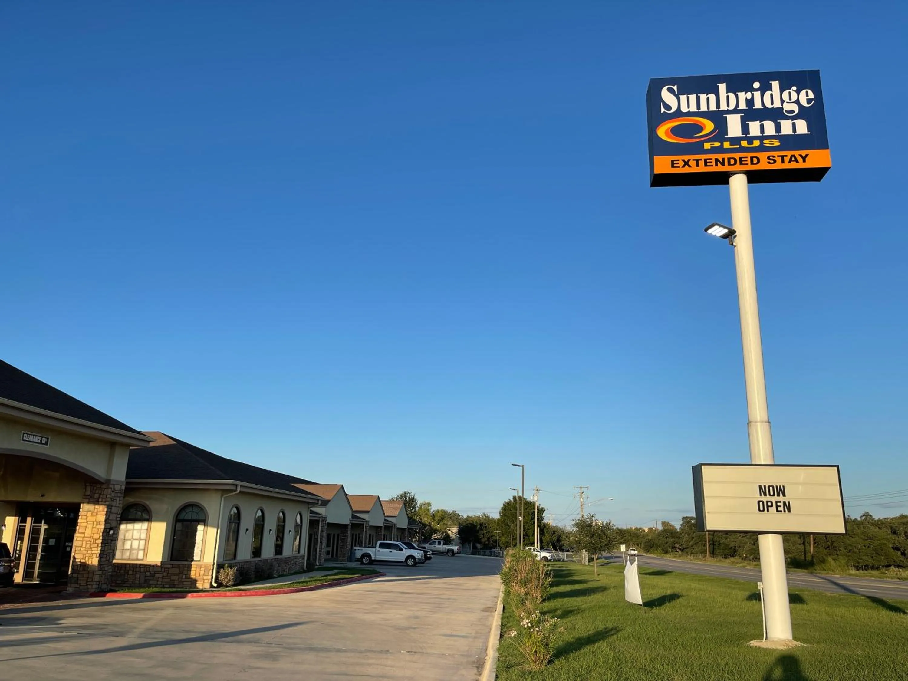 Property logo or sign in Sunbridge Inn & Suite Extended Stay