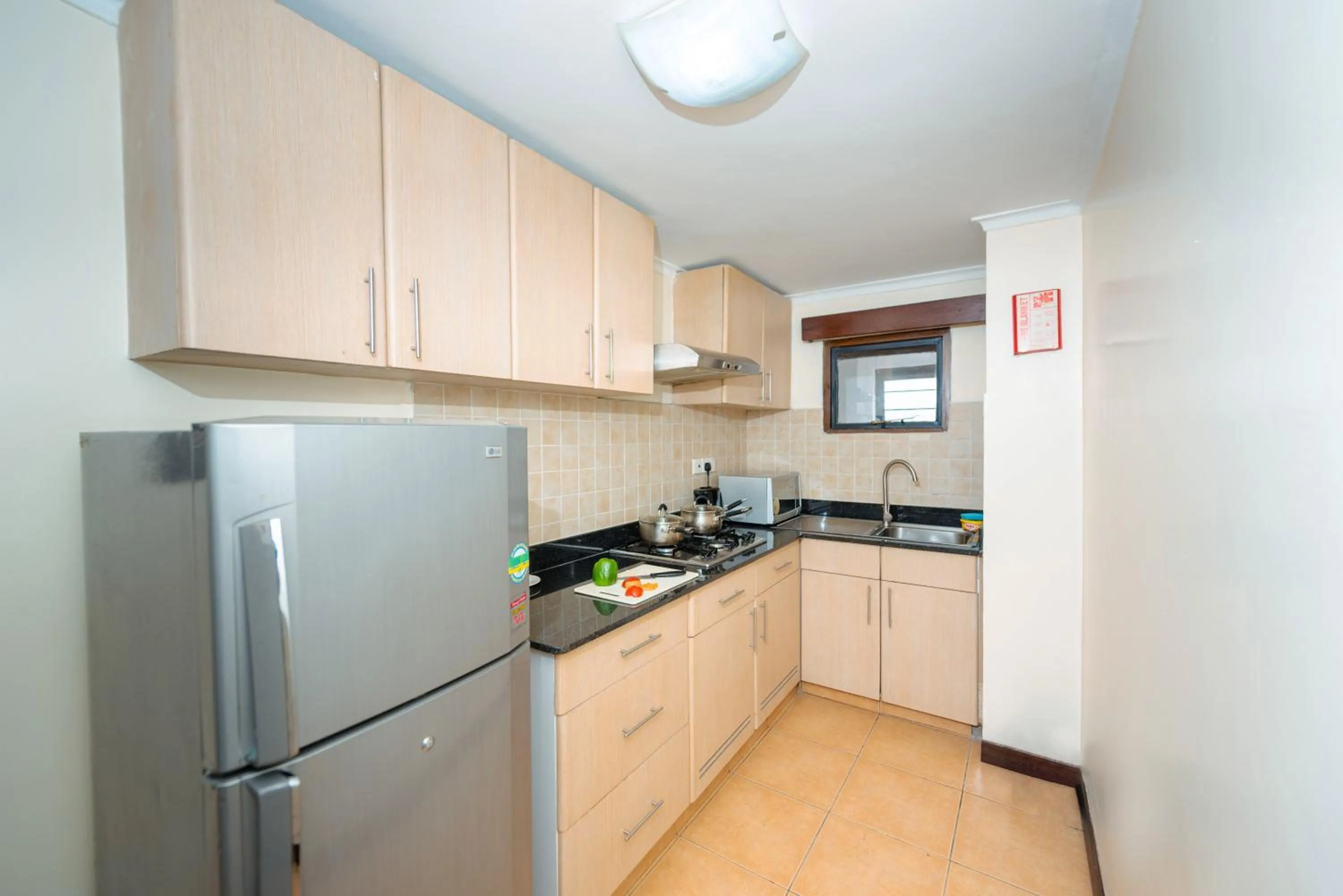 Kitchen or kitchenette in Heri Heights Hotel Apartments, SureStay Collection by Best Western